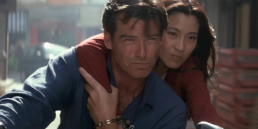 Pierce Brosnan and Michelle Yeoh ride down the street in the James Bond film Tomorrow Never Dies