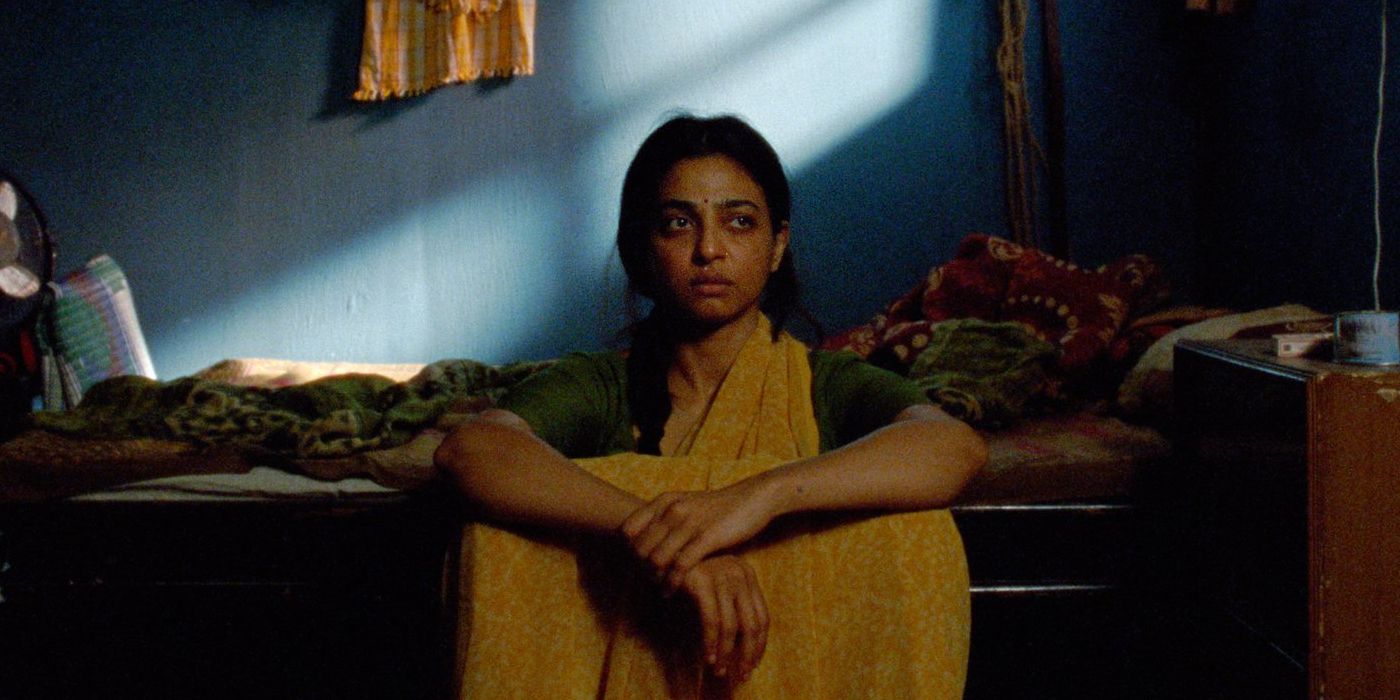 Radhika Apte as Uma sitting alone by her bed in Sister Midnight