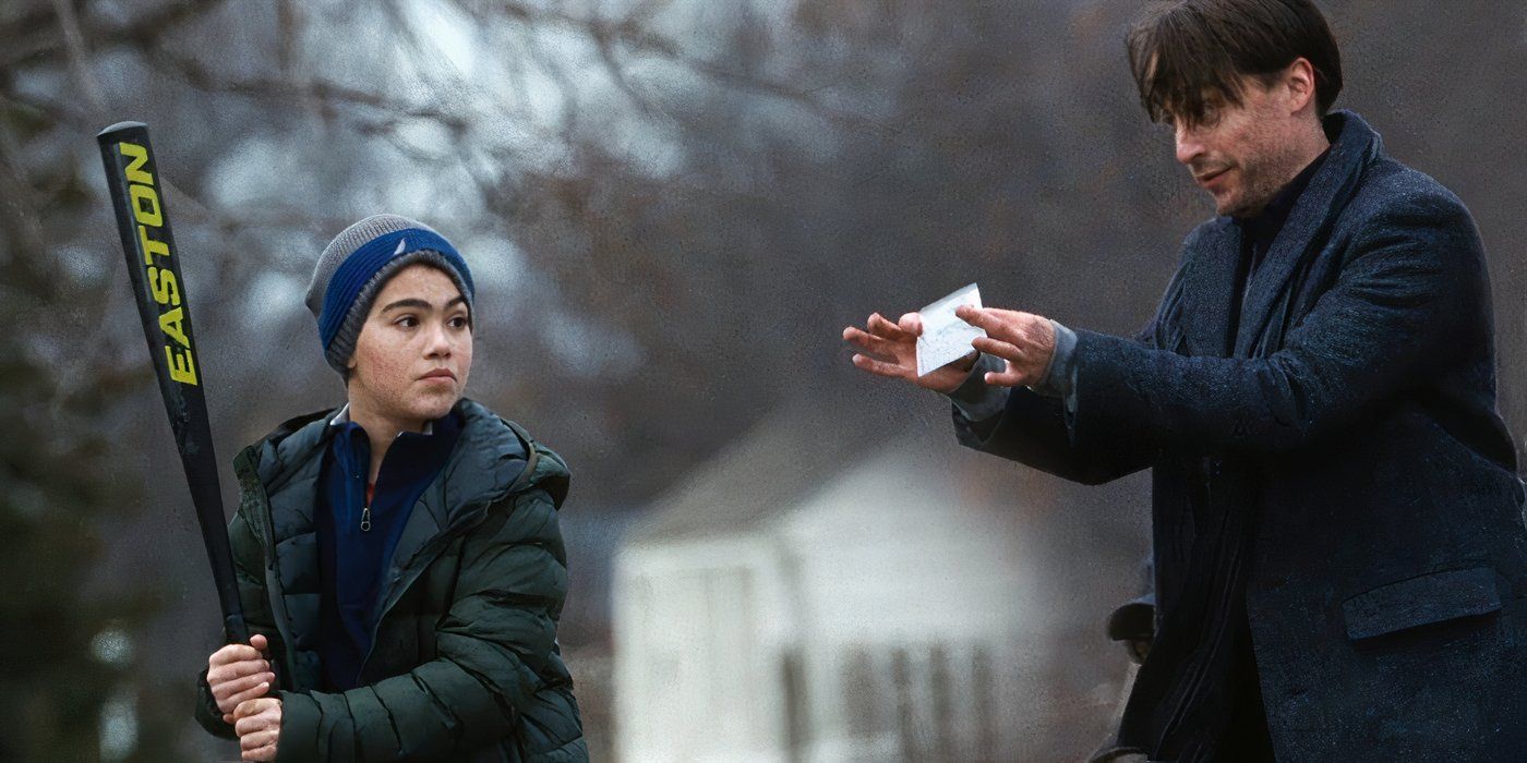 Roman Roy (Kieran Culkin) holding a million-dollar cheque in the face of a boy holding a baseball bat in Succession