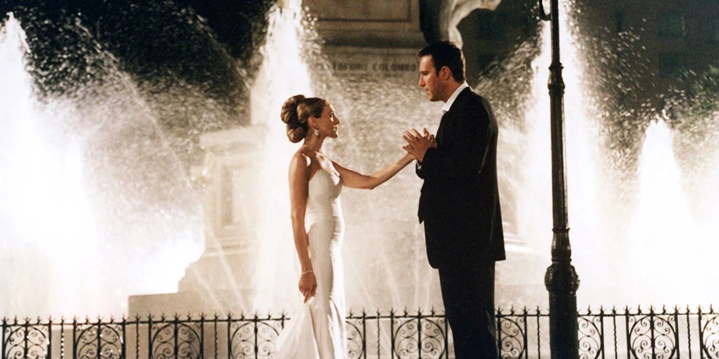 Carrie (Sarah Jessica Parker) and Aidan (John Corbett) in front of a fountain in Sex and the City