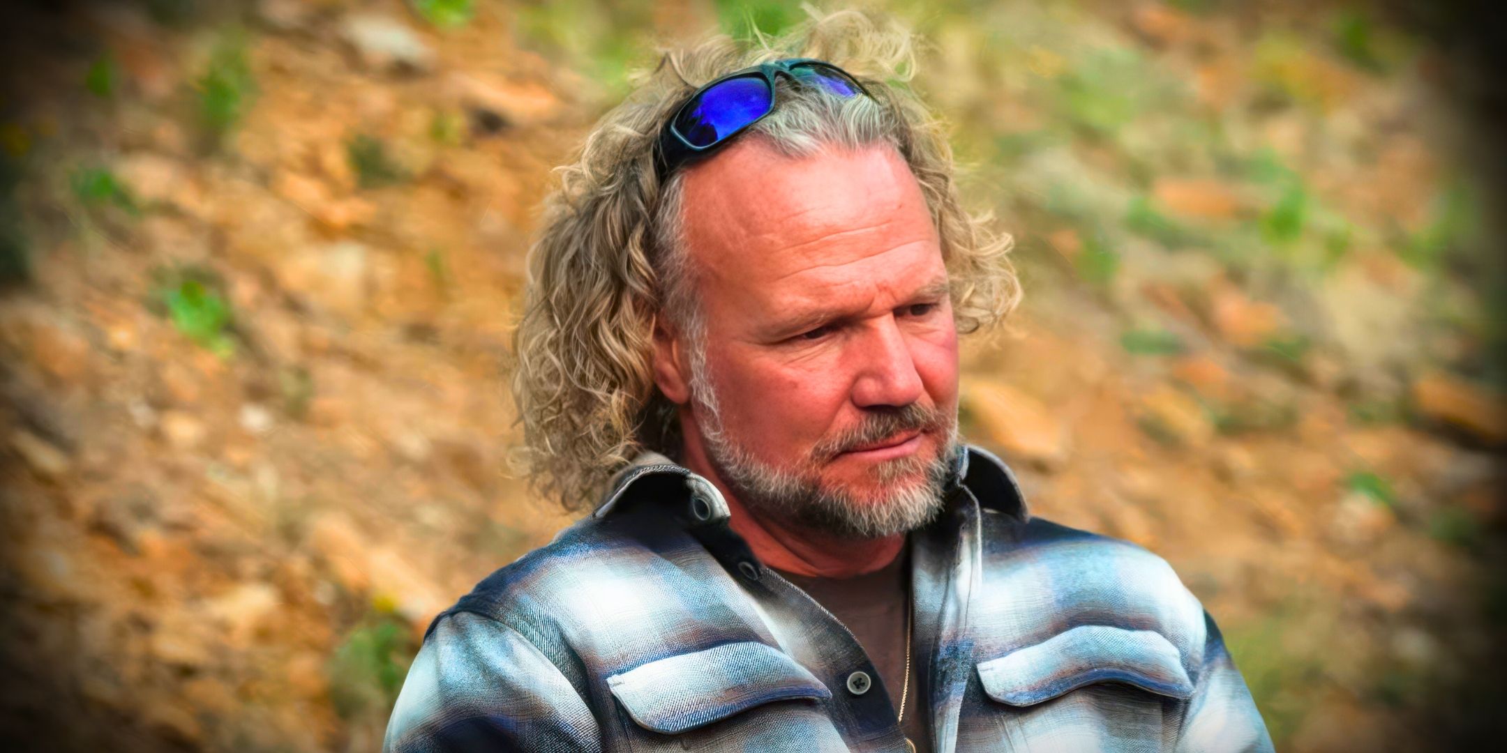 Sister Wives Kody Brown close up and looking down and sad