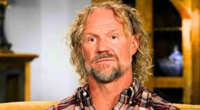 Sister Wives’ Kody Brown with a serious expression while sitting on a couch