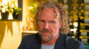Sister Wives star Kody Brown looking upset in close up with yellow interior background