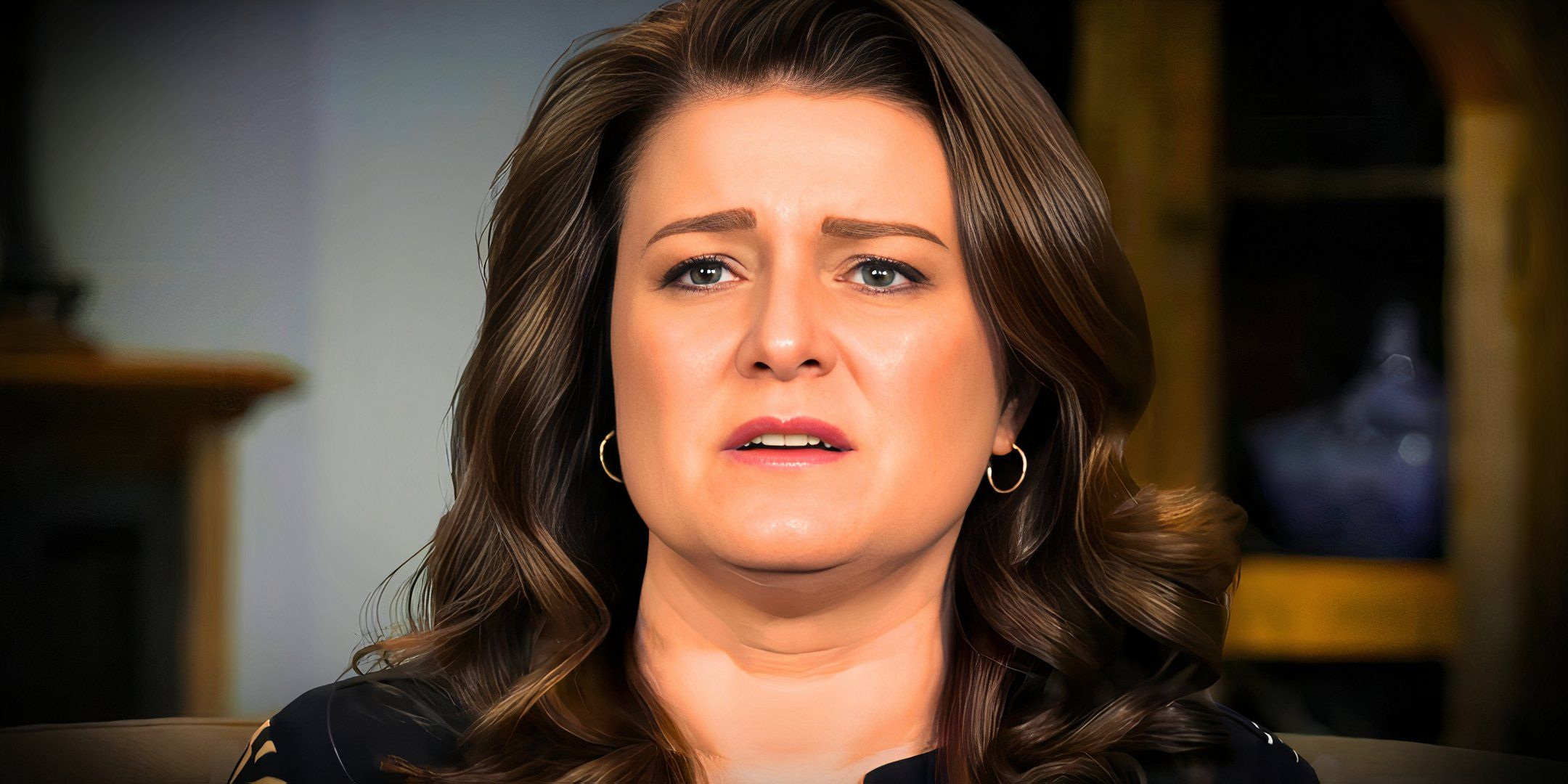 sister wives star Robyn Brown in a close up with her looking upset and a dark background