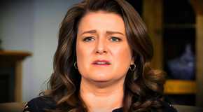 sister wives star Robyn Brown in a close up with her looking upset and a dark background