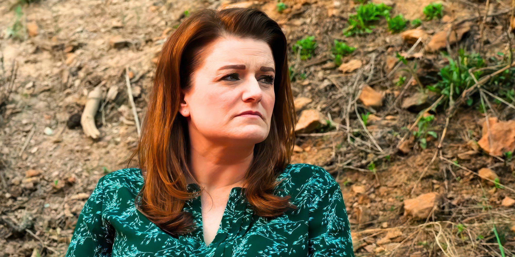 sister wives star robyn brown in a green blouse looking to the side with leaves in the background