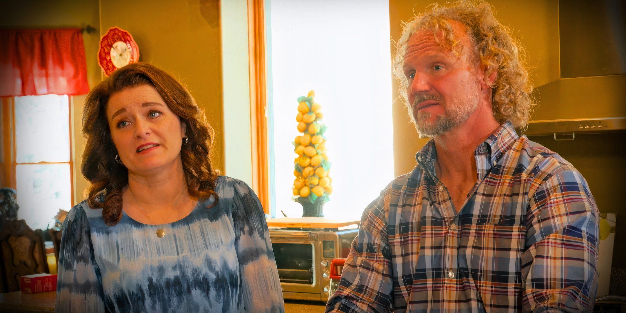 sister wives stars kody and robyn brown in a close up in kitchen