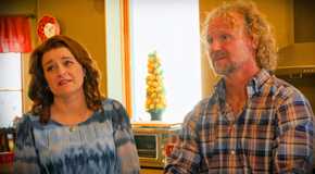 sister wives stars kody and robyn brown in a close up in kitchen