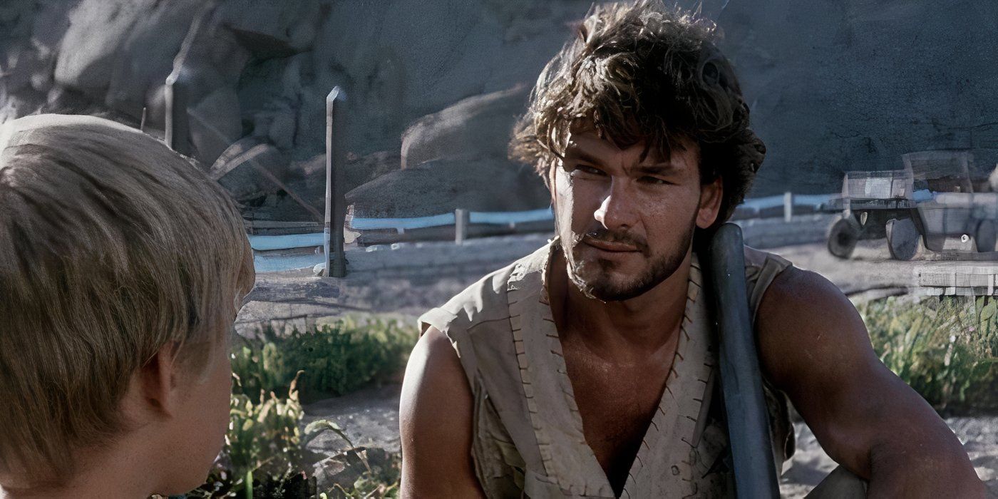 Patrick Swayze talks to a young boy in Steel Dawn.