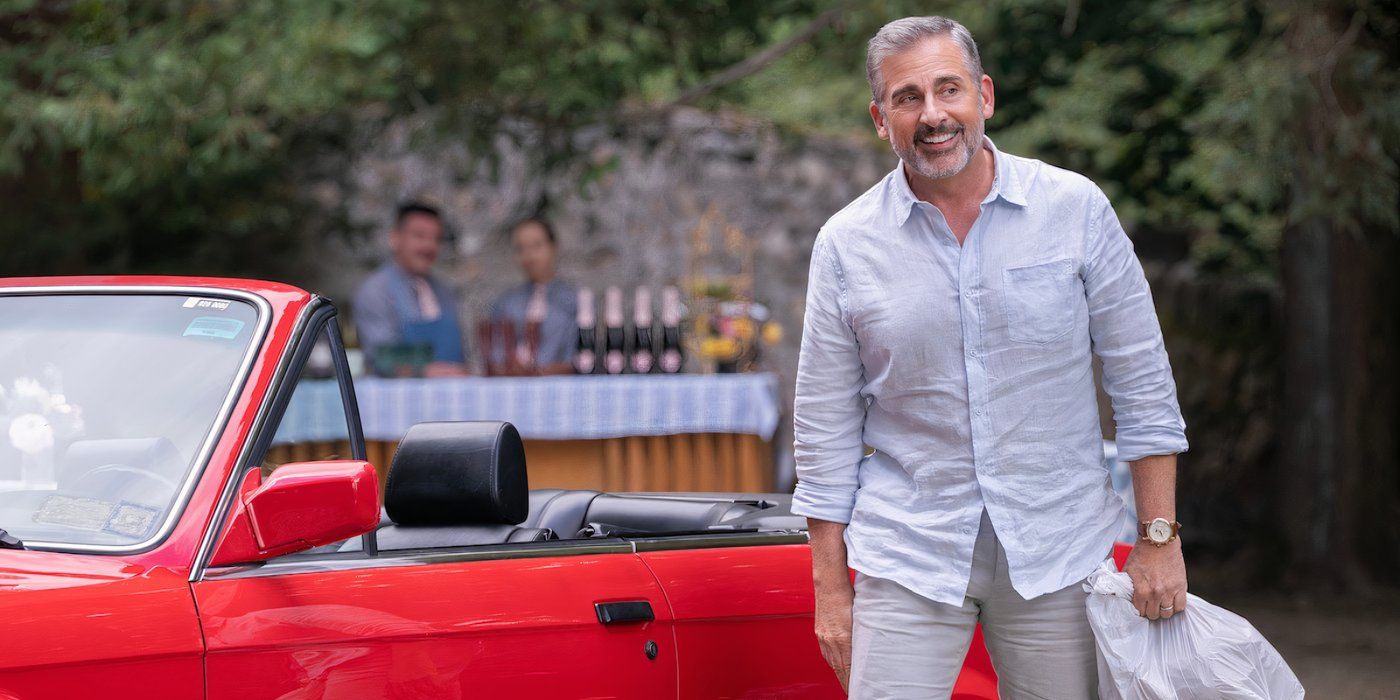 Steve Carell as Nick smiling while standing next to a red car in The Four Seasons