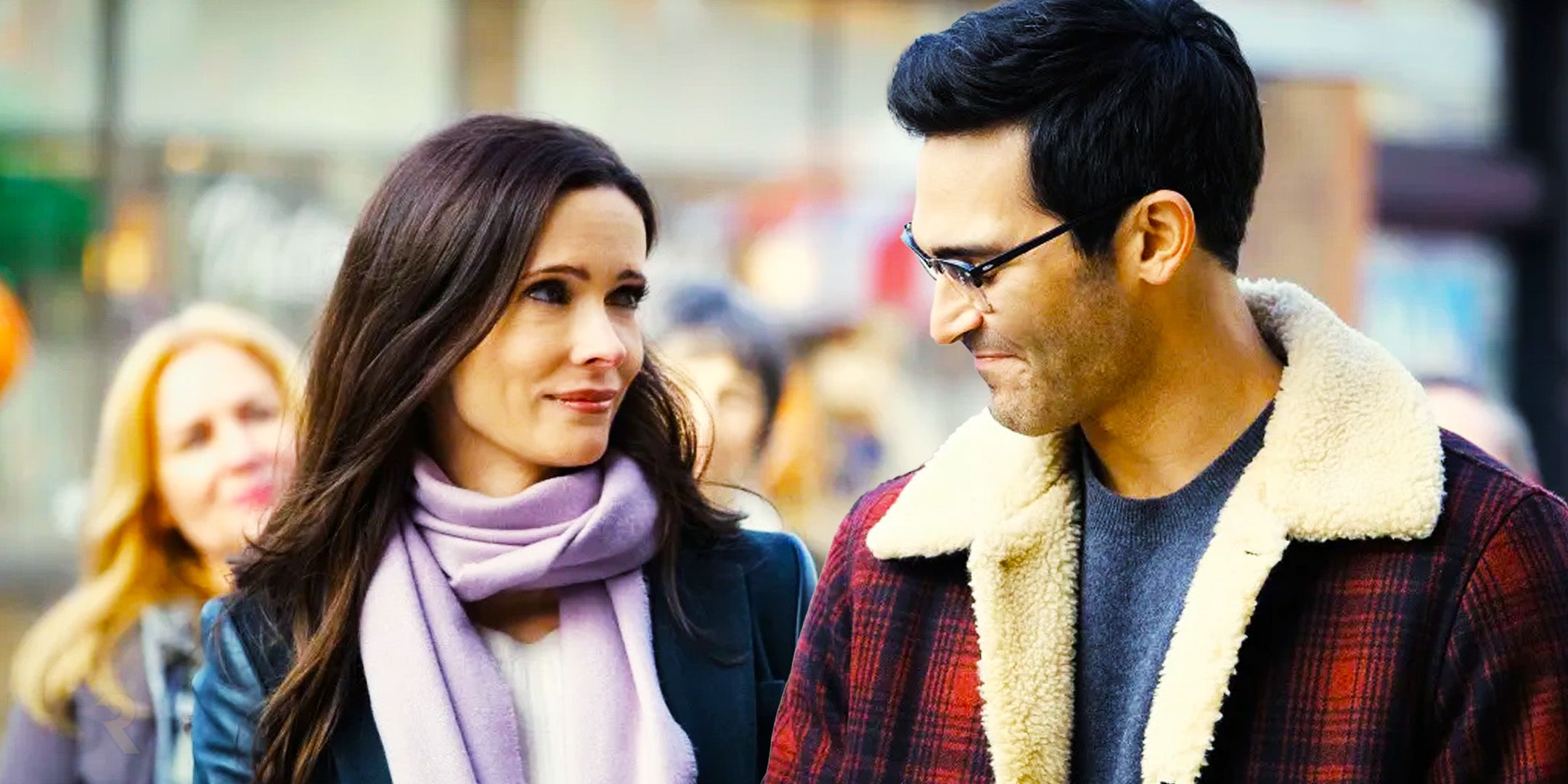 Superman and Lois' Tyler Hoechlin and Bitsie Tulloch walk beside each other smiling