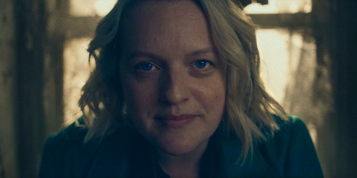 Close-up of June (Elisabeth Moss) with a subtle smil, looking directly at the camerae in The Handmaid's Tale Season 6 Ep 10