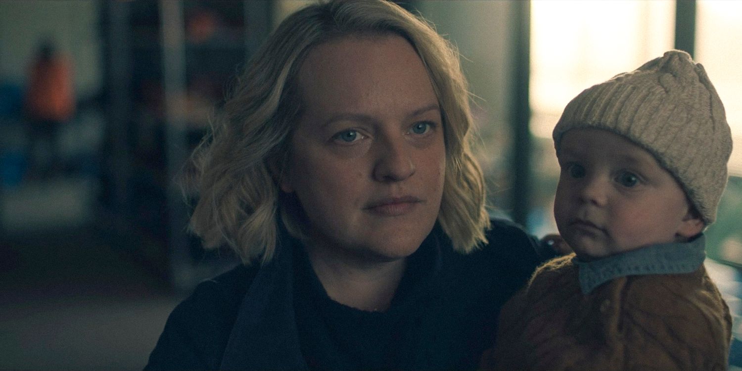 June (Elisabeth Moss) holding Noah, Serena’s baby in The Handmaid's Tale Season 6 Ep 10