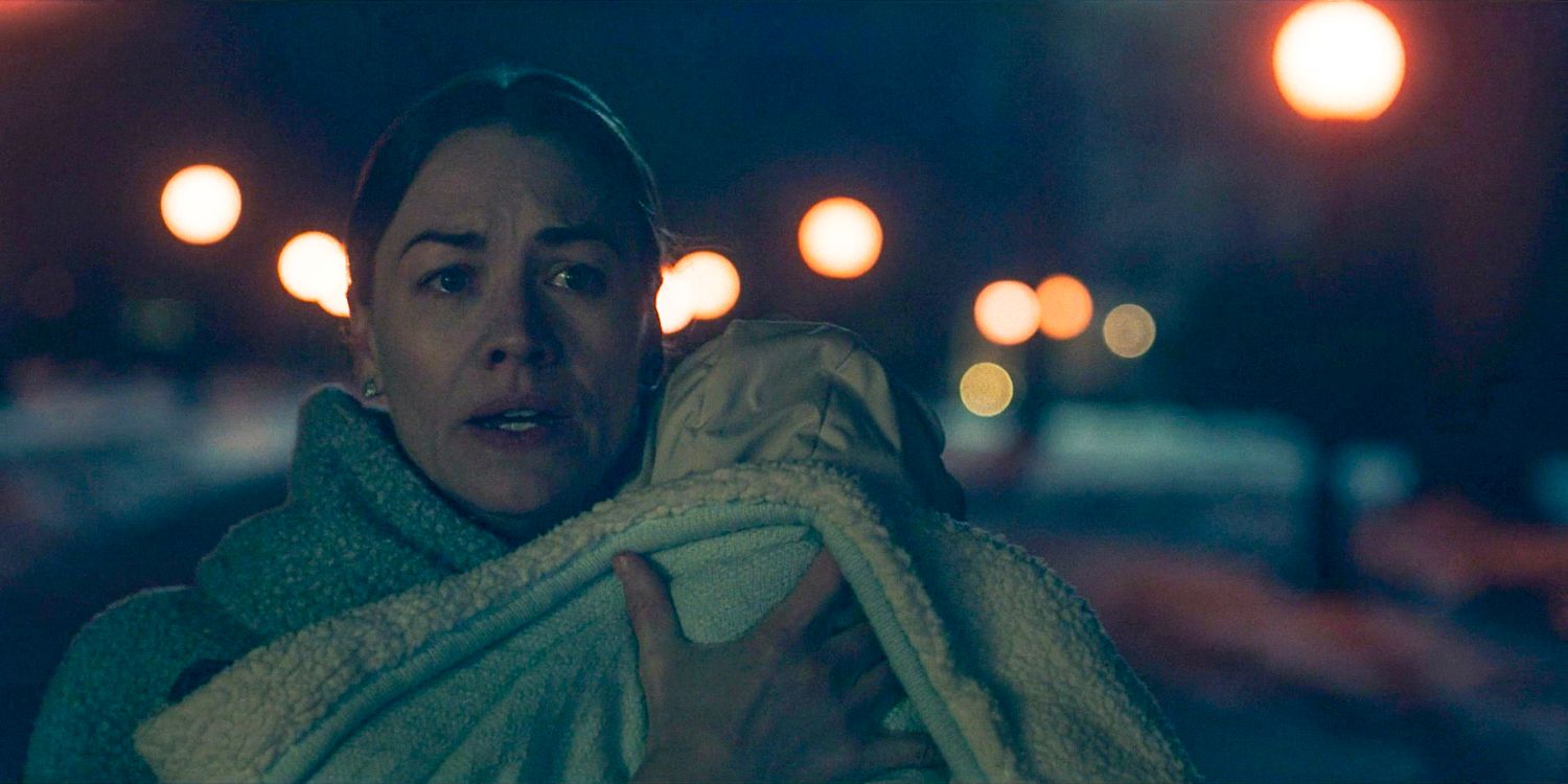 Serena (Yvonne Strahovski) running away while carrying her baby in The Handmaid's Tale Season 6 Ep 9