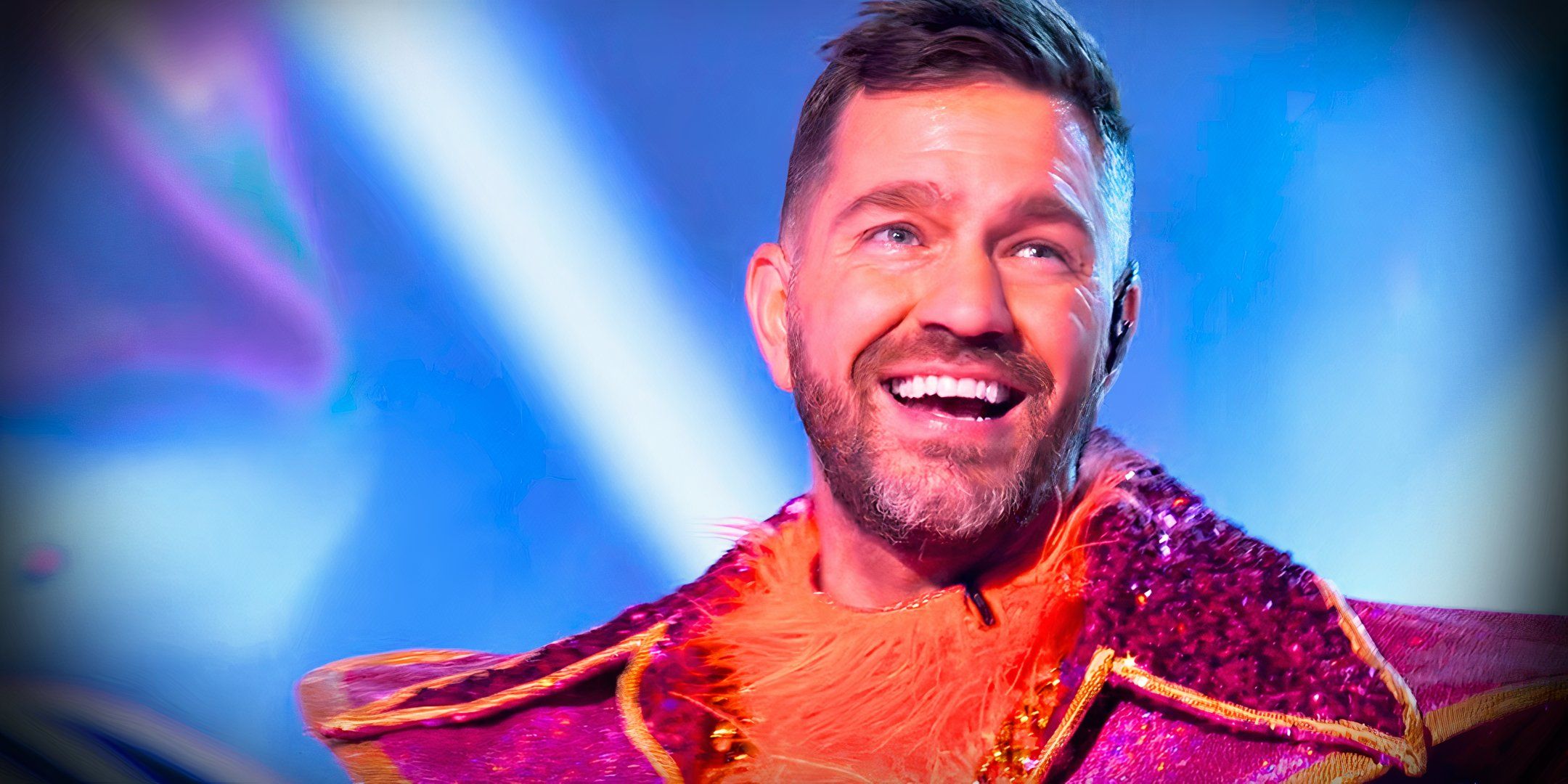 the masked singer season 13 star andy grammer smiling after being unmasked