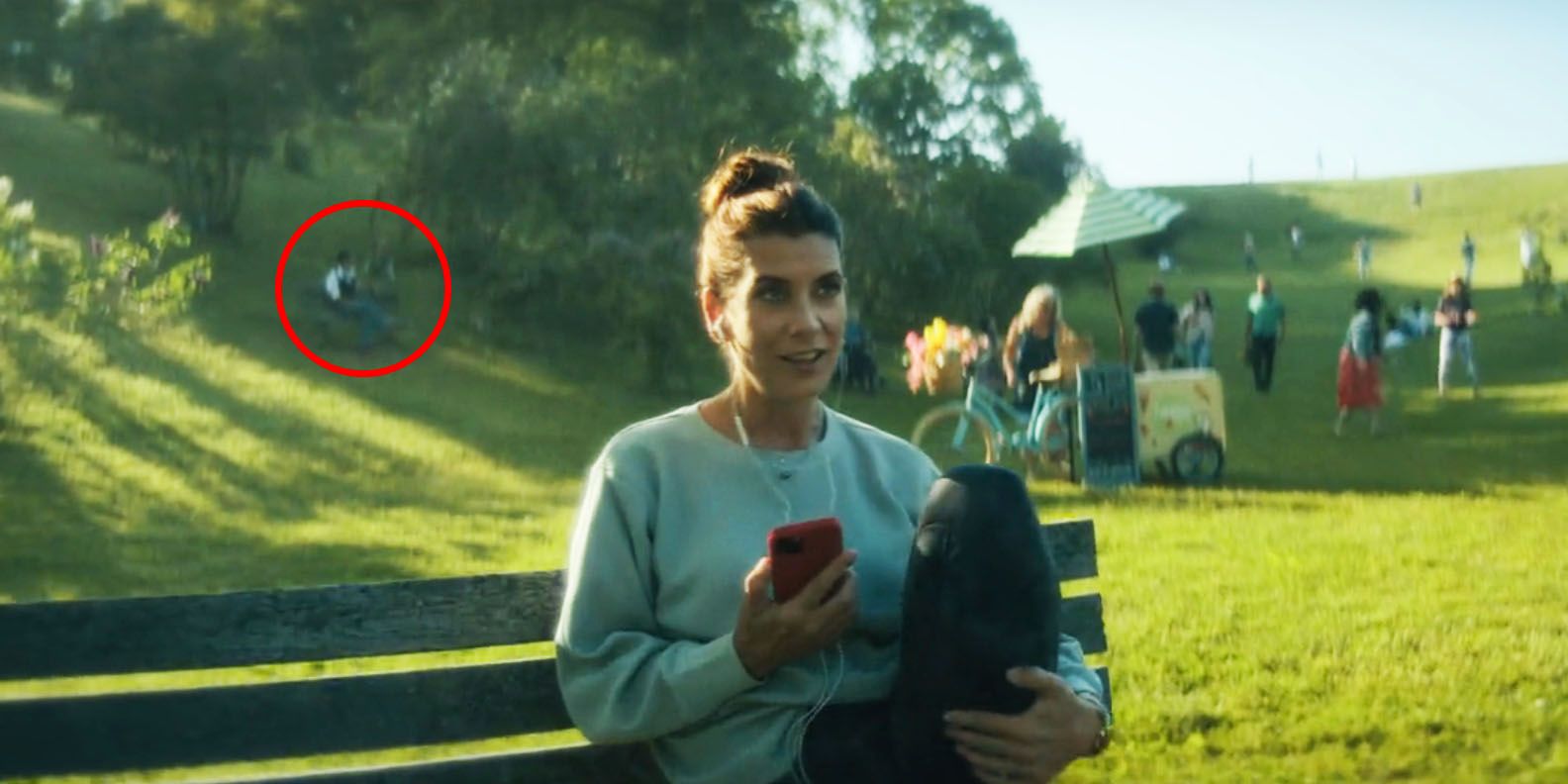 The Umbrella Academy season 4 park scene Dolores behind the Handler