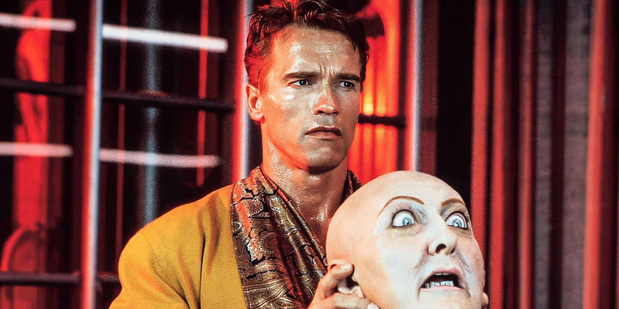Quaid holding the Two Weeks mask in Total Recall