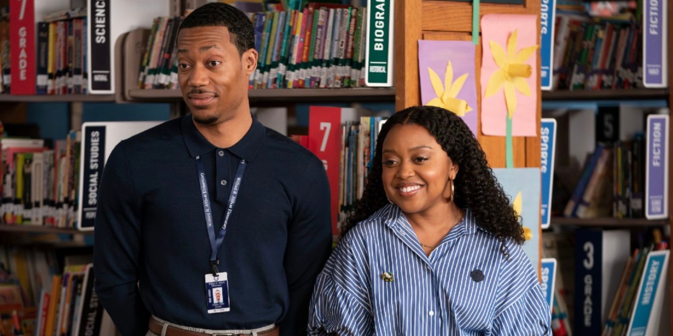 Tyler James Williams' Gregory and Quinta Brunson's Janine smile in the library from Abbott Elementary