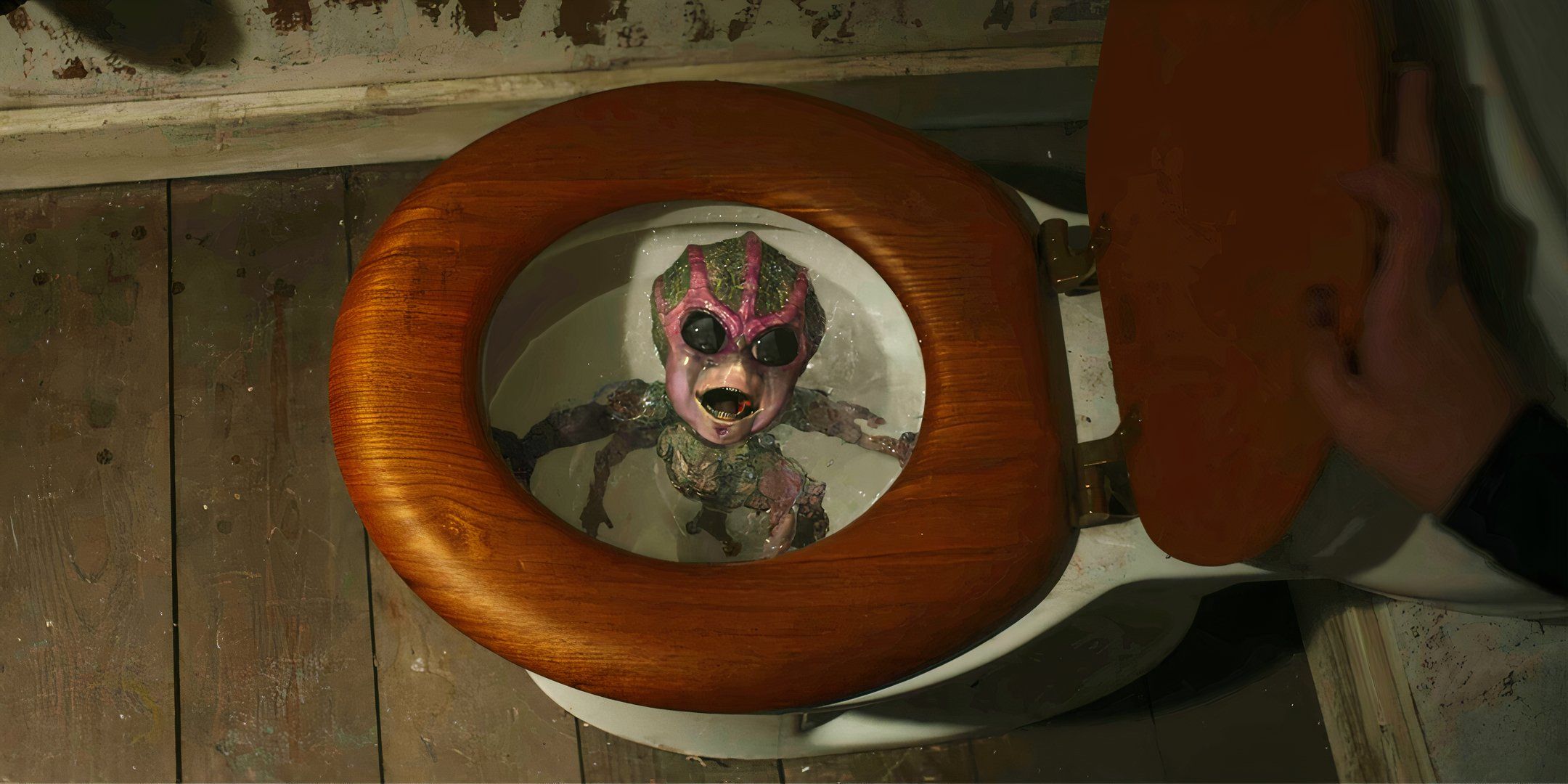 An alien baby floating in a toilet bown in Resident Alien