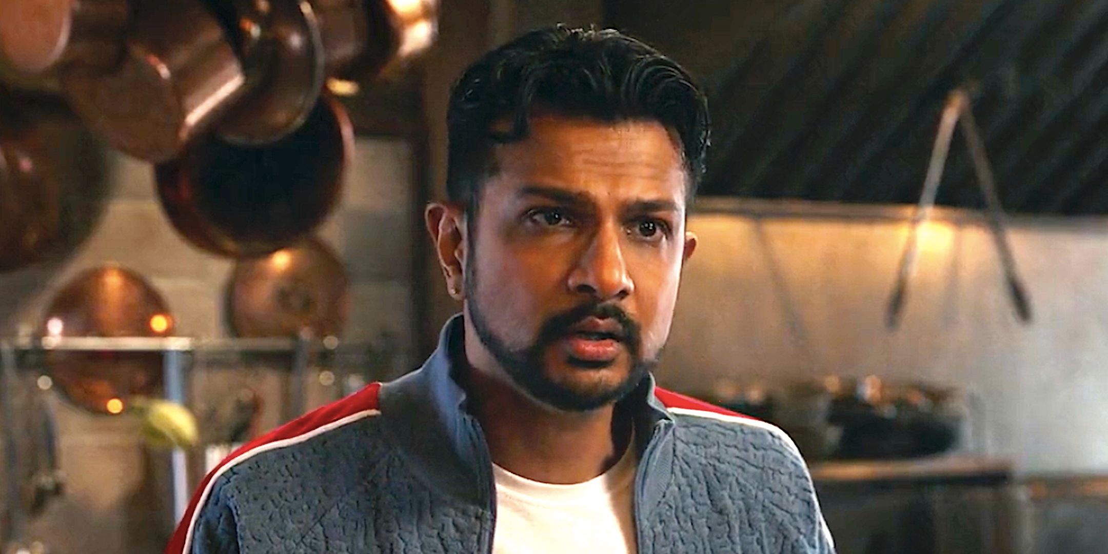 Utkarsh Ambudkar&rsquo;s Jay looking concerned in a restaurant kitchen from Ghosts season 4 episode 21