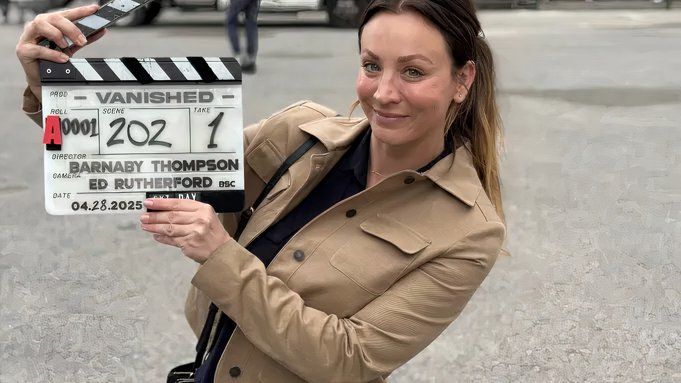 Kaley Cuoco holding a slate on the set of Vanished