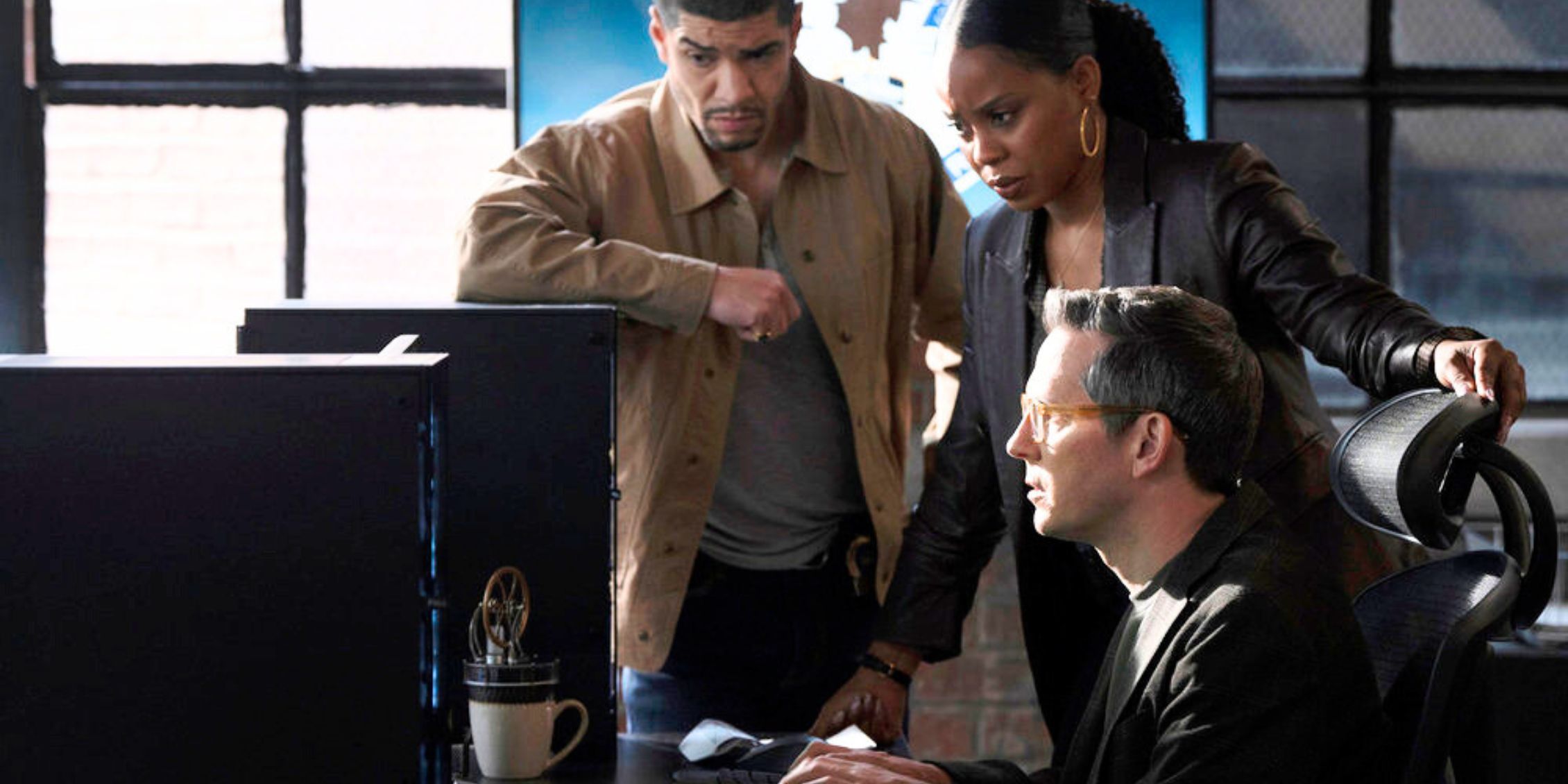 Vargas looking at a computer with Bell and Reyes in Law & Order: Organized Crime