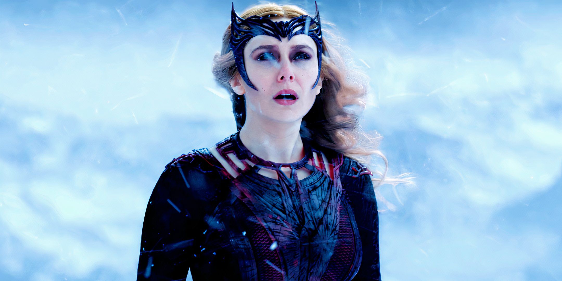 Wanda Maximoff Scarlet Witch looking up in the snow on Mount Wundagore in Doctor Strange in the Multiverse of Madness