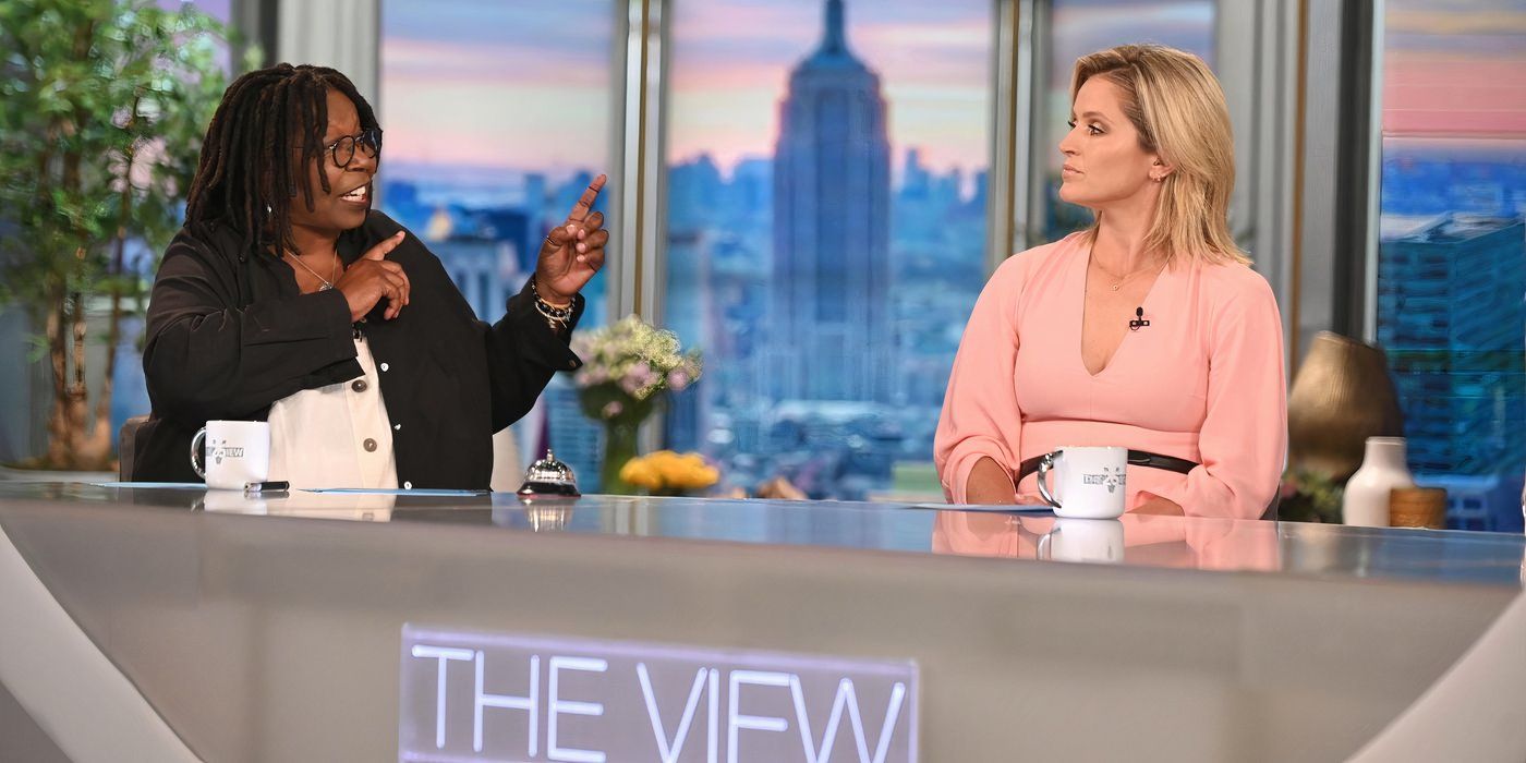 The View's Whoopi Goldberg and Sara Haines sitting at The View desk together