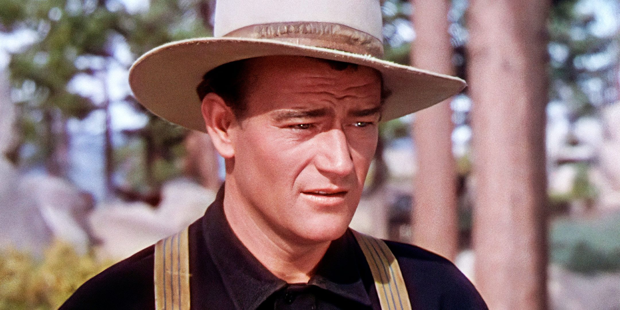 John Wayne as Young Matt wearing a hat outdoors in The Shepherd of the Hills.