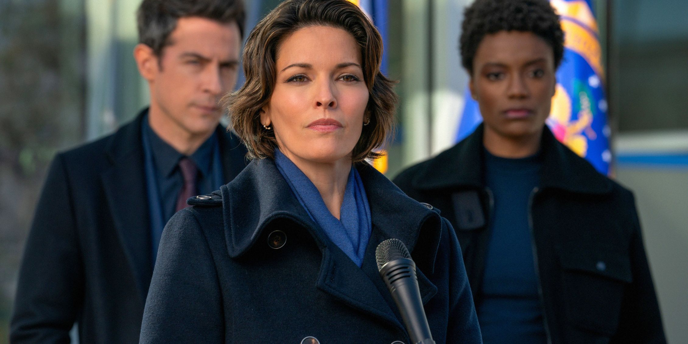 Isobel, Scola, and iffany standing ith eFBI office during a press conference