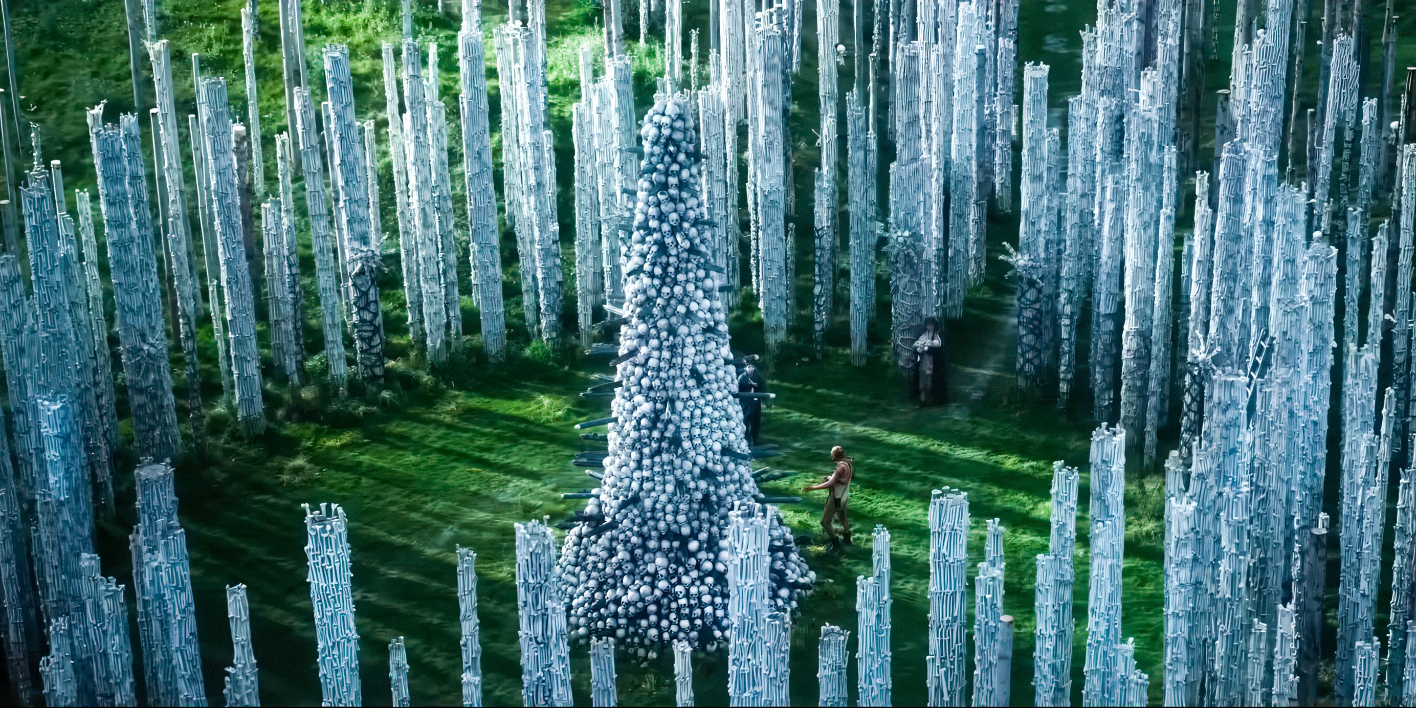 An aerial view of Ralph Fiennes as Dr Kelson standing in the bone temple in 28 Years Later