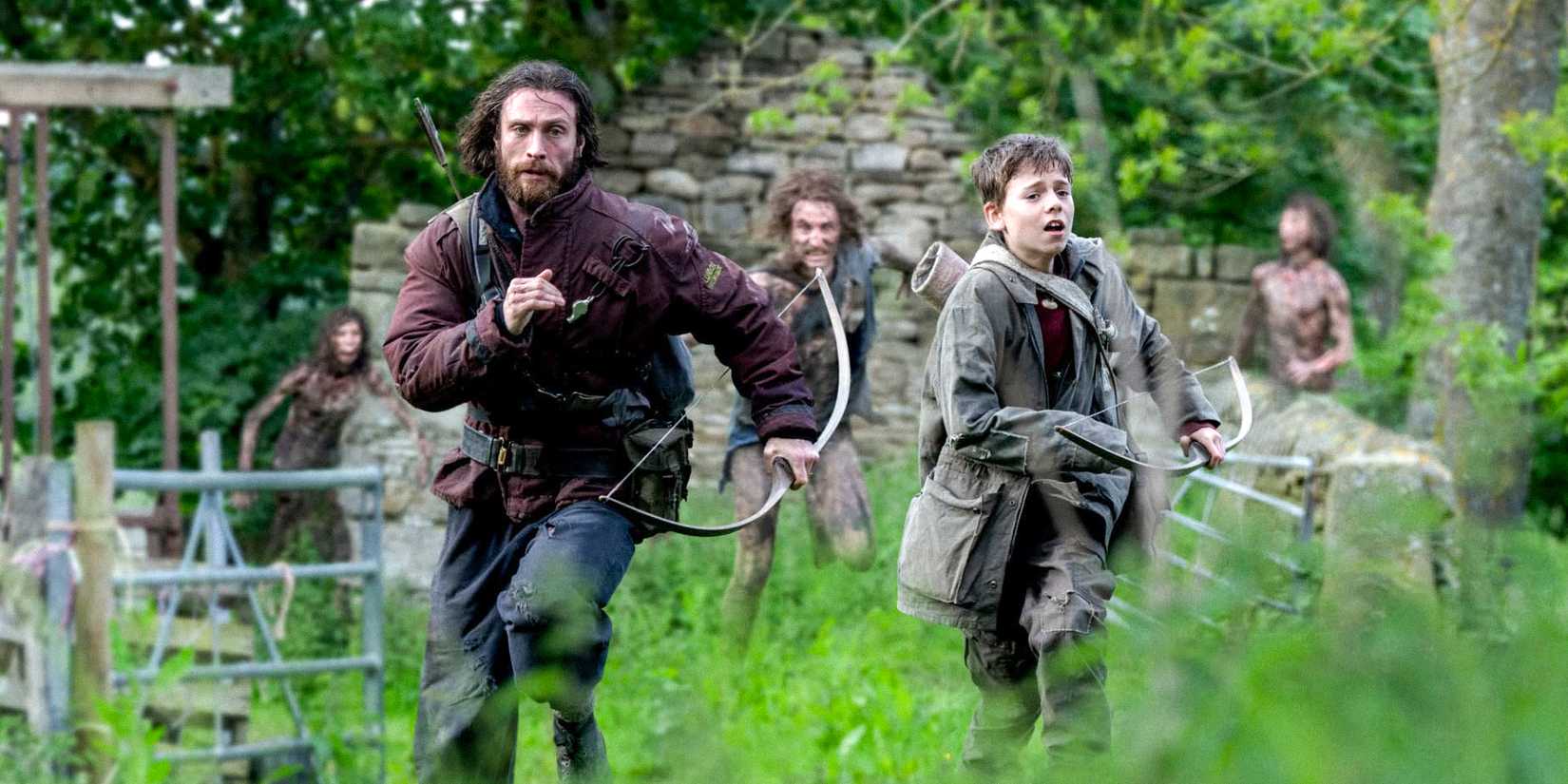 Jamie (Aaron Taylor-Johnson) and Spike (Alfie Williams) running away from infected in 28 Years Later