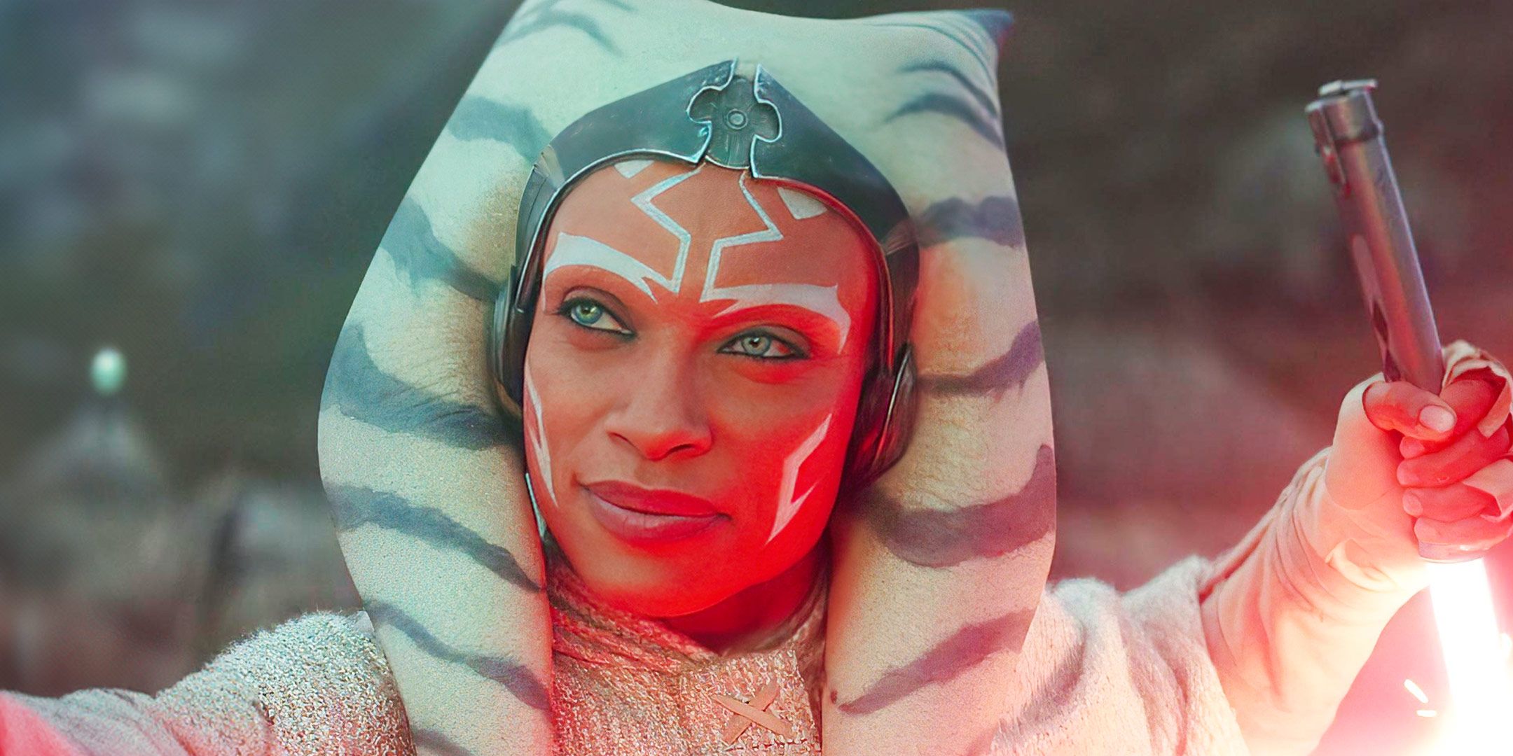 Rosario Dawson as Ahsoka Tano holding a lightsaber up in the Ahsoka show