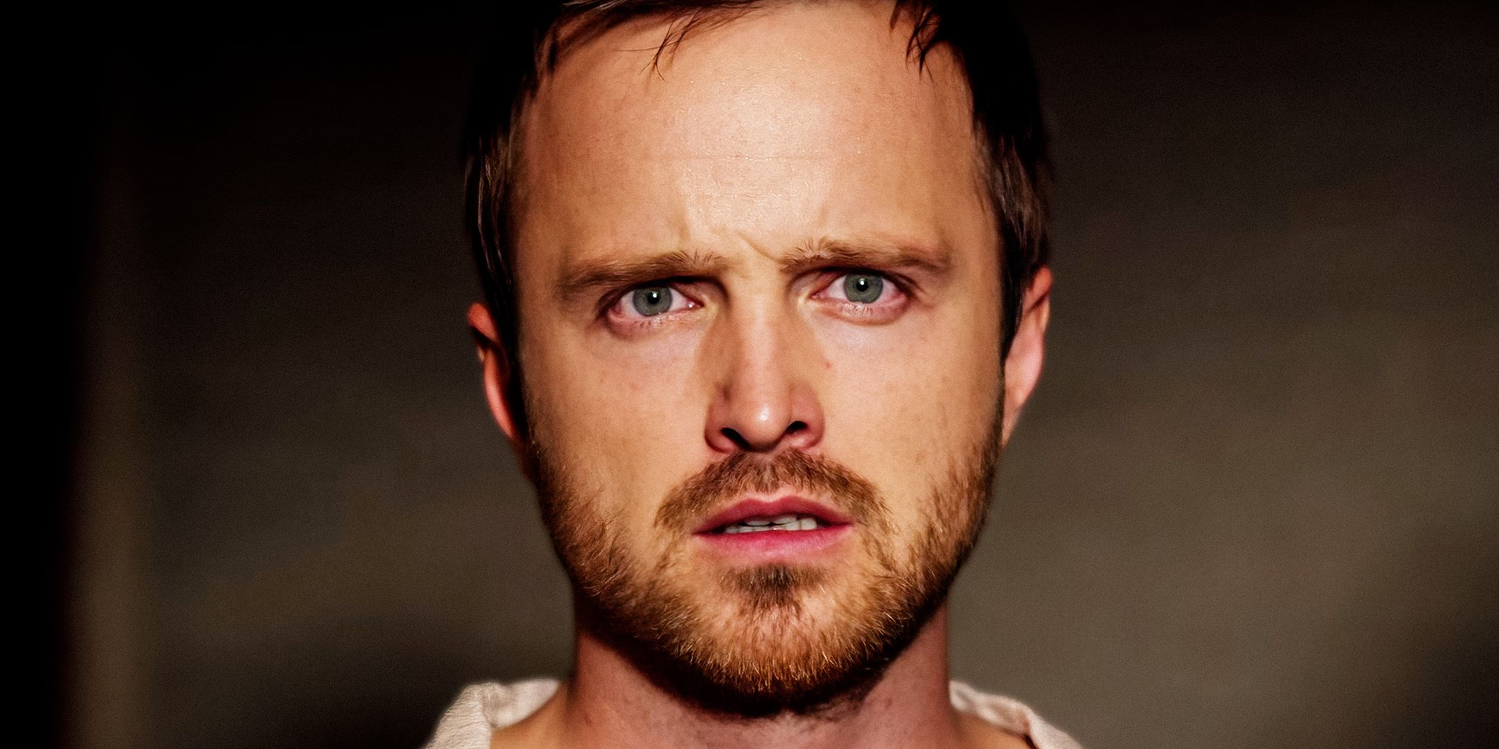 Aaron Paul looking surprised and unhappy in The Path