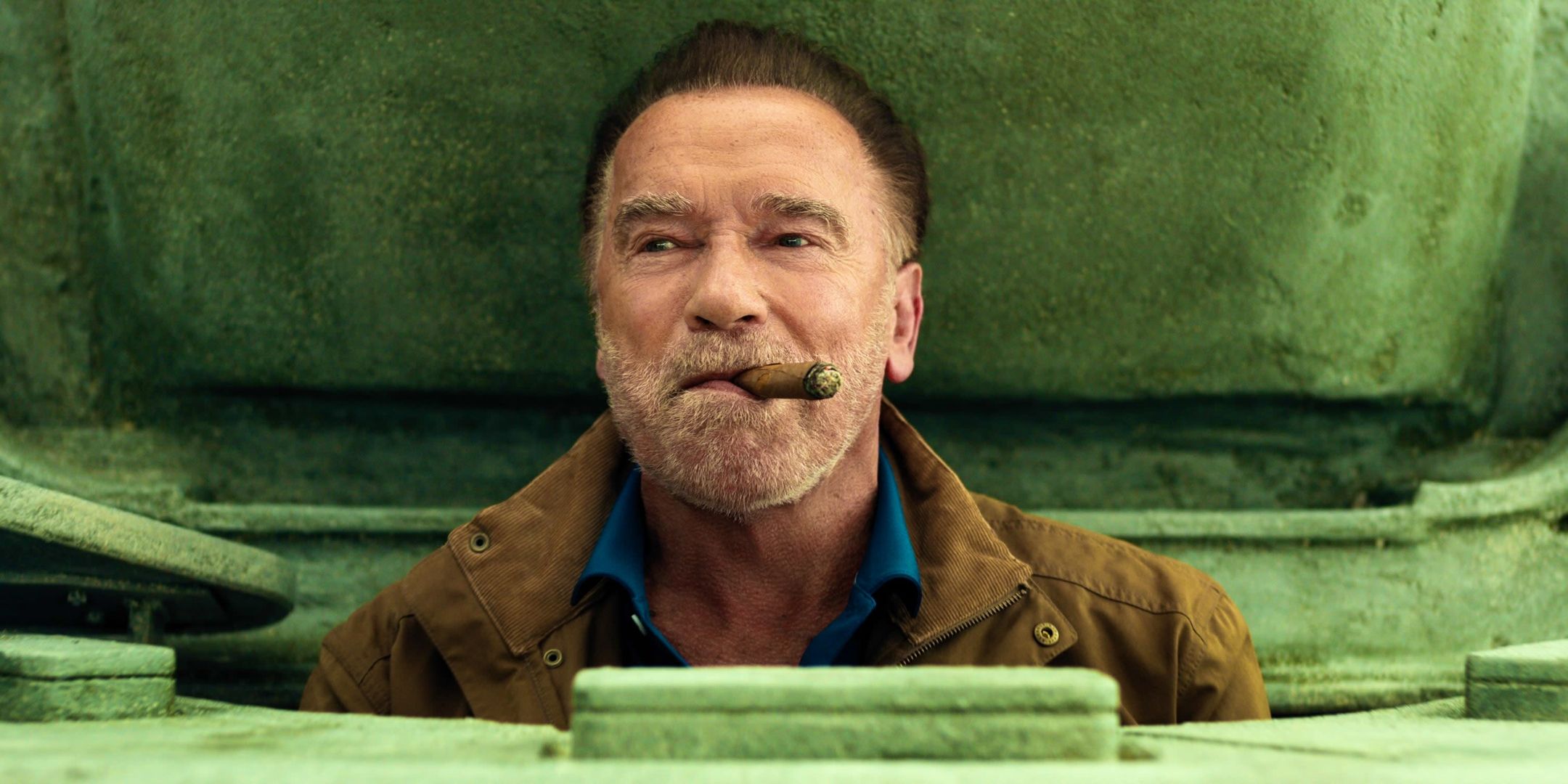 Arnold Schwarzenegger as Luke driving a tank and smoking a cigar in FUBAR season 2