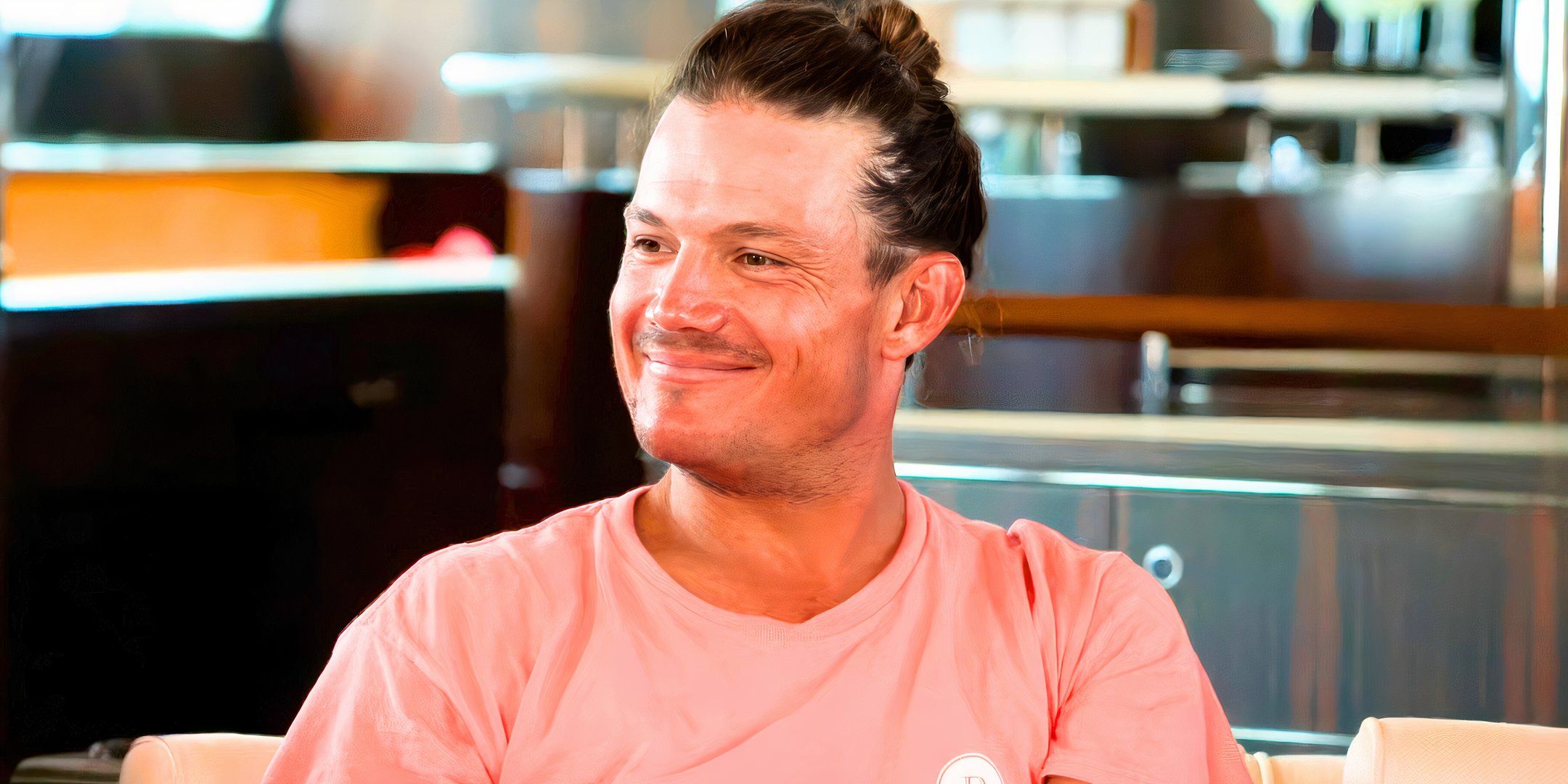 Below Deck franchise star Gary King in a pink t shirt smiling
