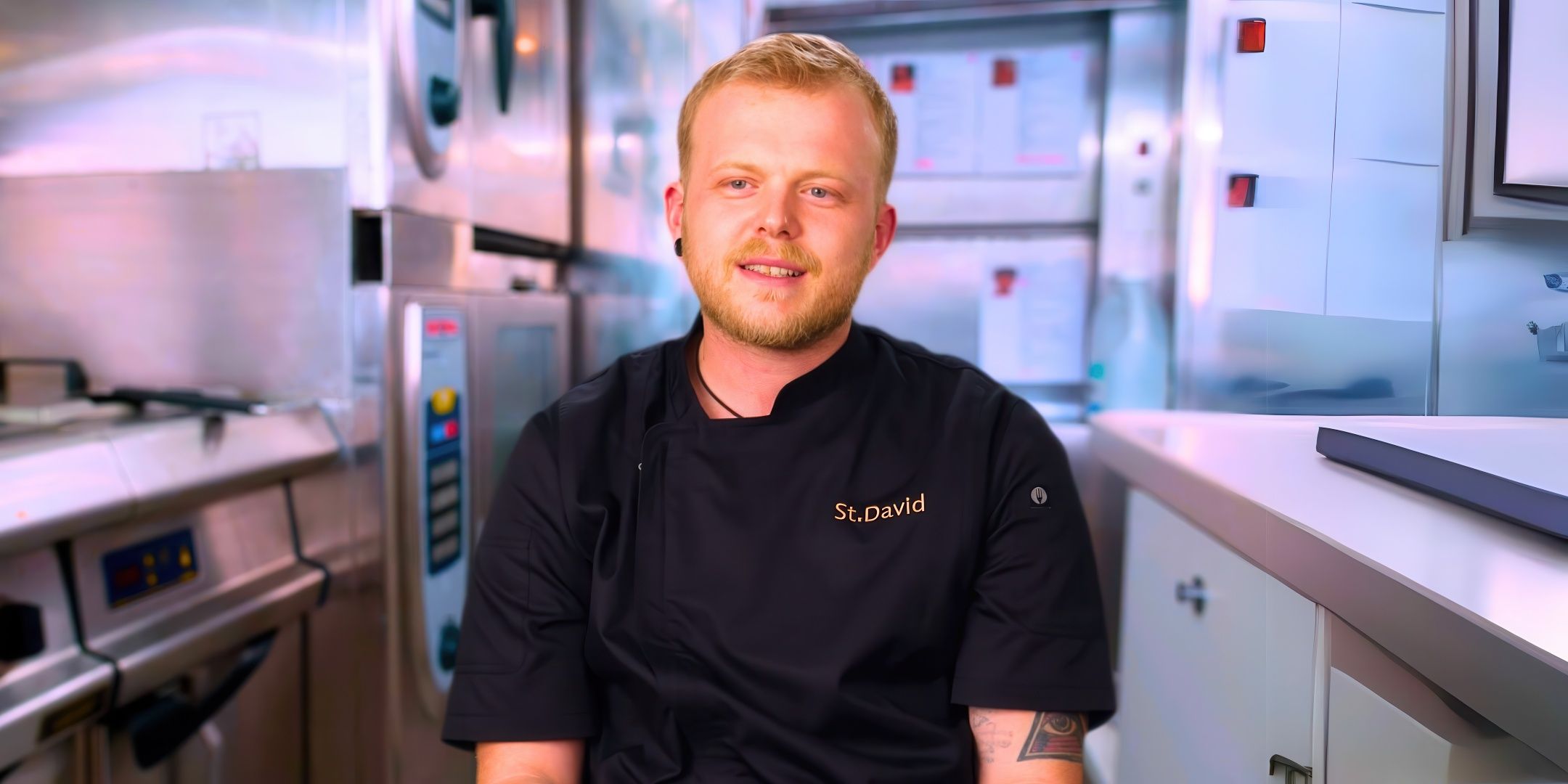 Below Deck's Lawrence Snowden smiles in the galley