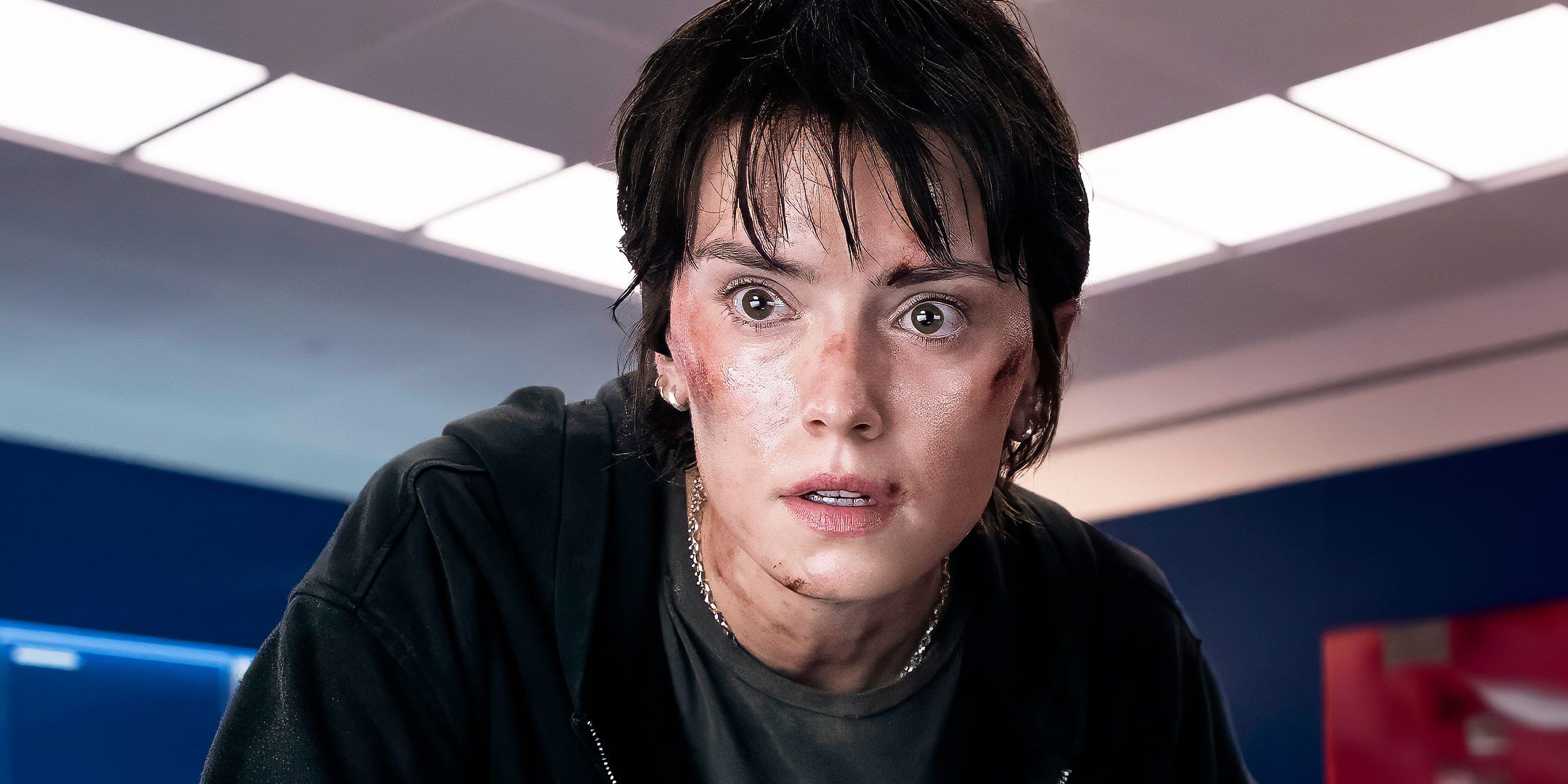 Daisy Ridley with cuts and bruises looking intently in Cleaner