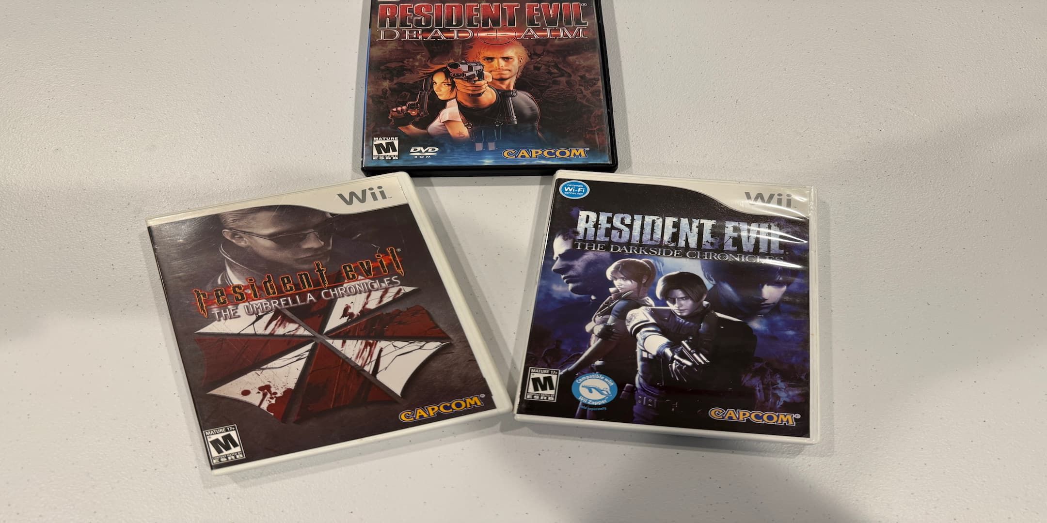 Dead Aim e Umbrella Chronicles PS2 Casos Retro