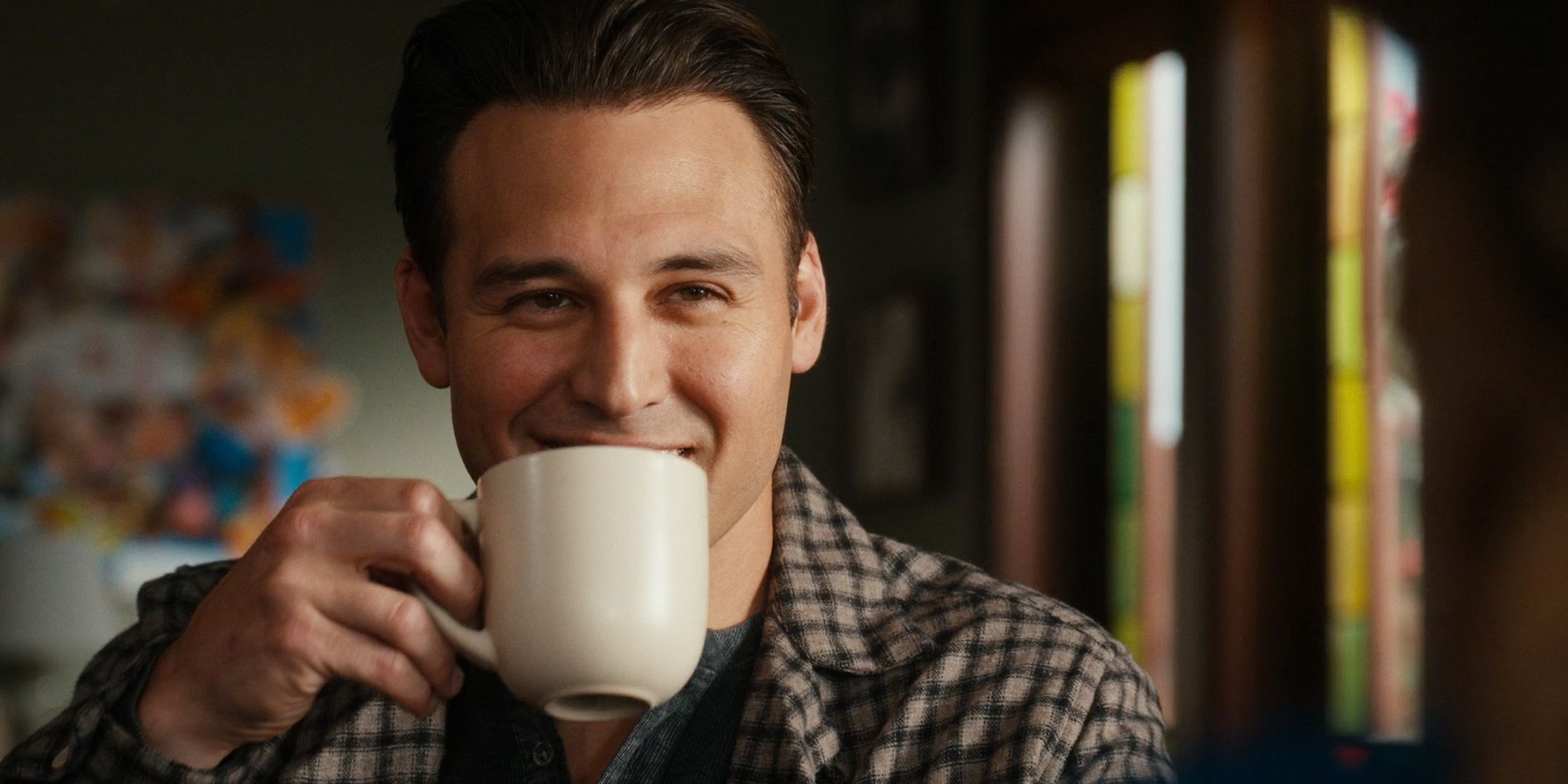 Ryan Guzman as Eddie Diaz sipping from a mug in 9-1-1 season 8.