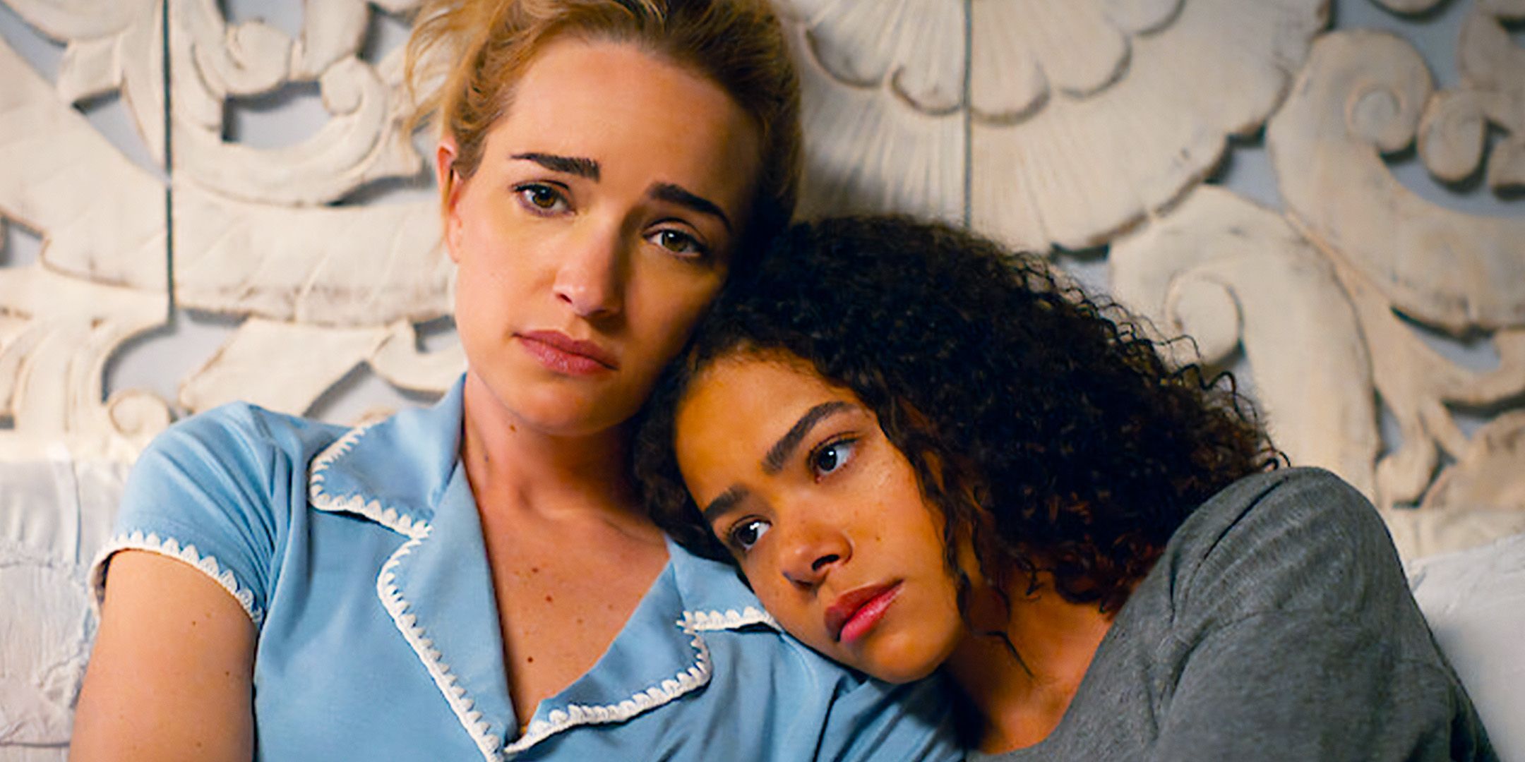 Ginny (Antonia Gentry) looking sad and resting her head on Georgia's (Brianne Howey