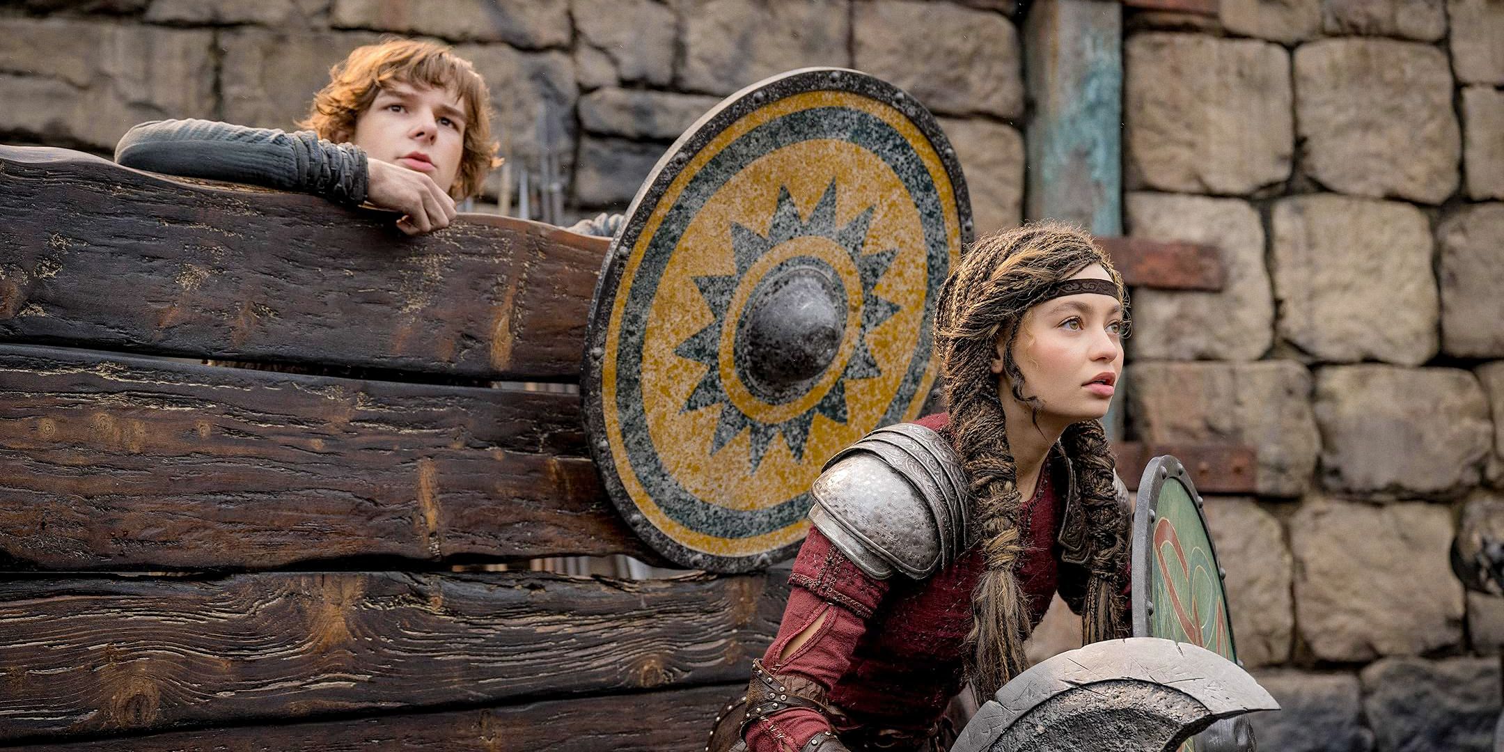Hiccup (Mason Thames) and Astrid (Nico Parker) in the combat cell in How To Train Your Dragon (2025)