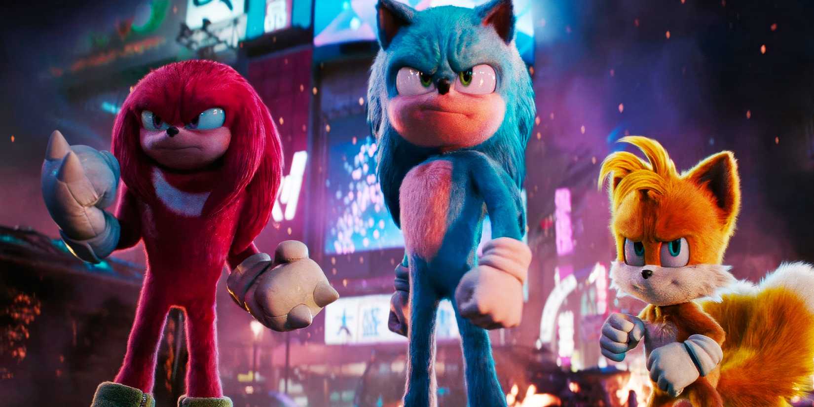 Sonic, Knuckles, and Tails stand dramatically in a city in Sonic the Hedgehog 3
