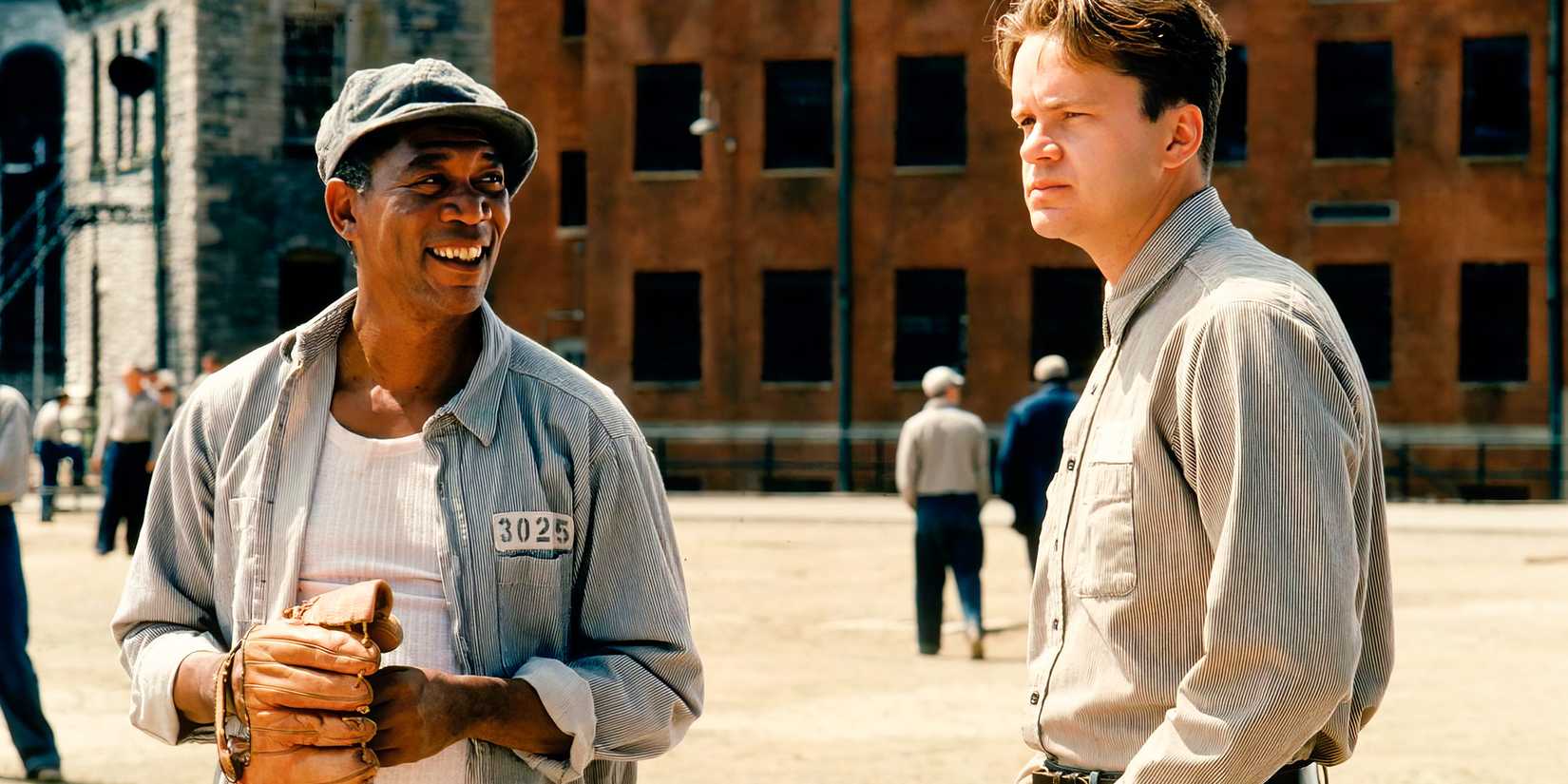 Morgan Freeman as Red Redding and Tim Robbins as Andy Dufresne in the prison yard in Shawshank Redemption