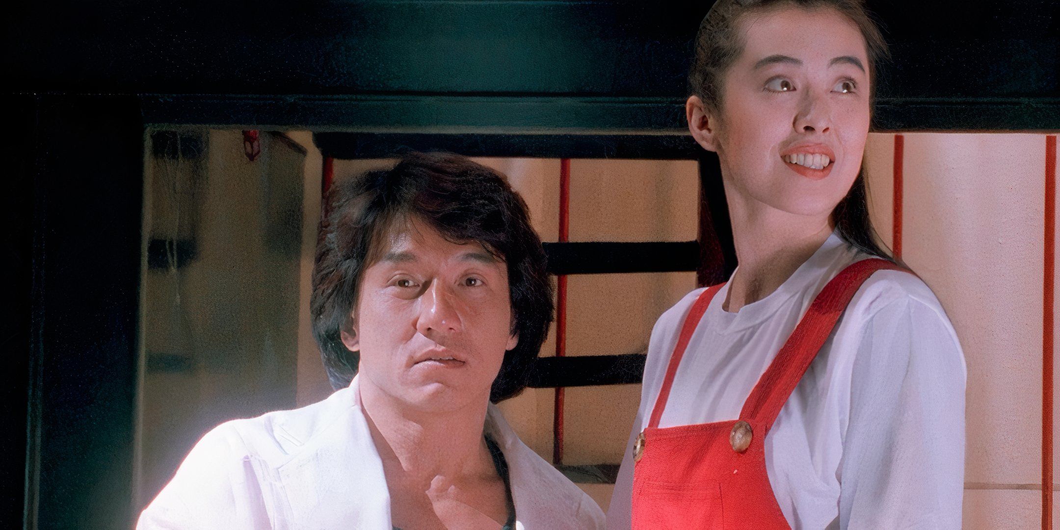Jackie Chan looks in the camera's direction and Joey Wang glances to the side.