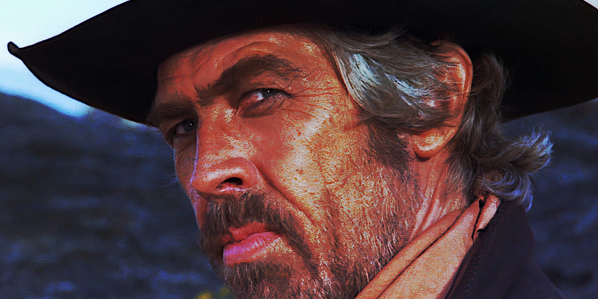 James Coburn glares toward the camera in a scene from A Reason to Live, A Reason to Die