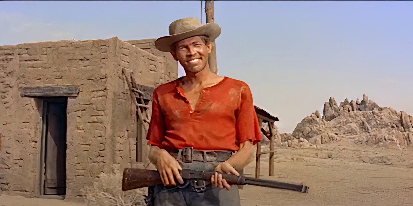 James Coburn smiles while holding a rifle in a scene from Ride Lonesome