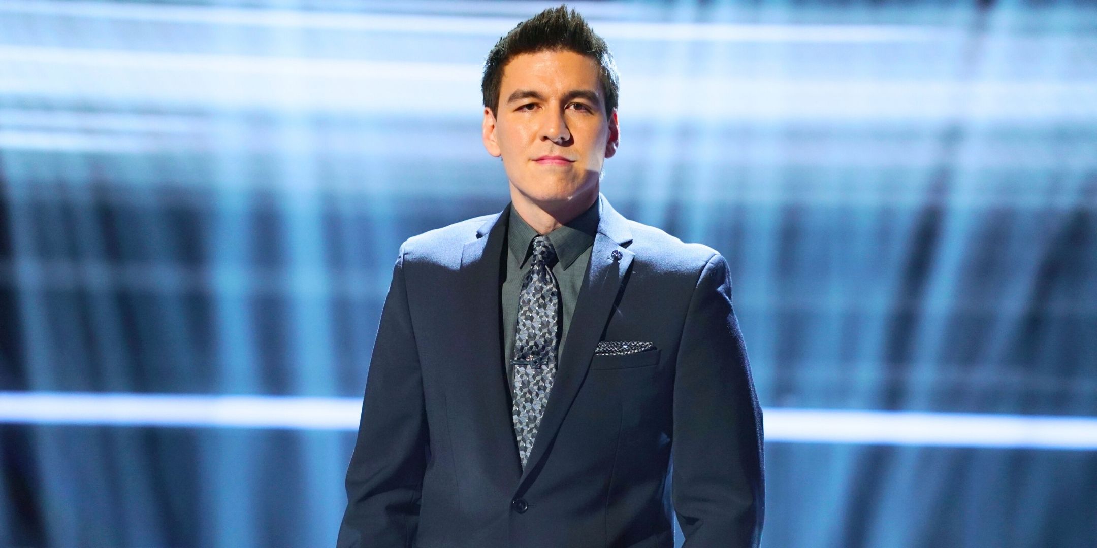 Jeopardy!'s James Holzhauer looks at the camera with a stern expression