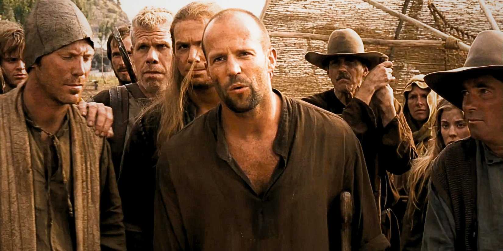 Jason Statham as Farmer surrounded by villagers in In The Name of the King