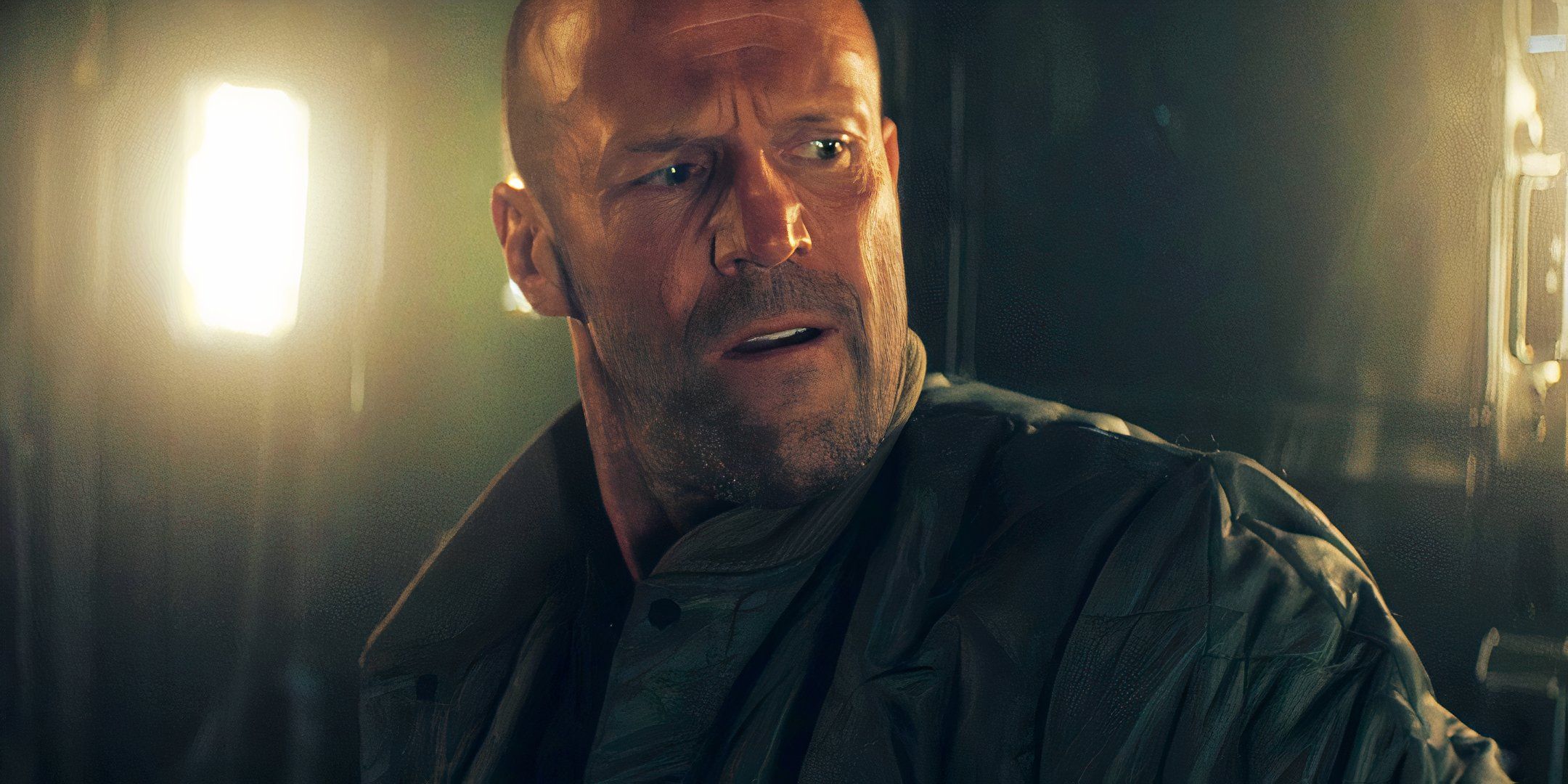 Jason Statham looking over his shoulder as Levon Cade in A Working Man